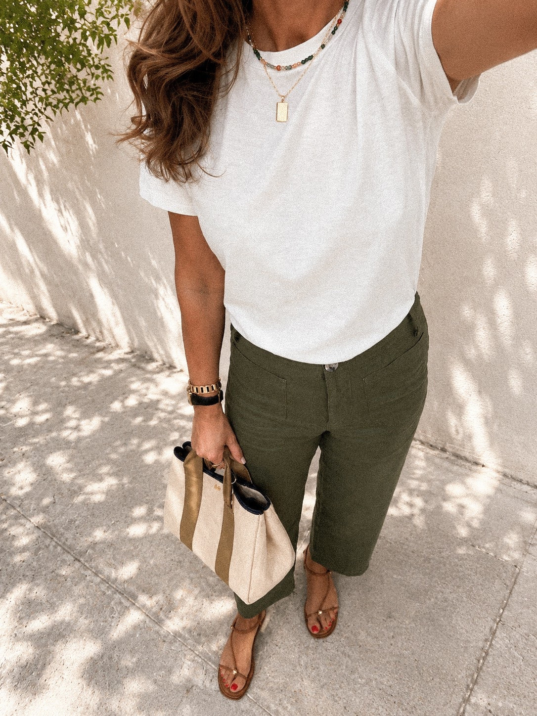 I live in linen pants during summer…lightweight and breathable outside, but still comfortable when the AC indoors is working overtime.
I grabbed them in another color. I took my bigger size (they do stretch out a tad making my them perfectly relaxed).  
The white tee is perfect weight and not see-through.  
Sandals are almost identical to the $275 pair except these have a way better insole and I found them for $50!!!!