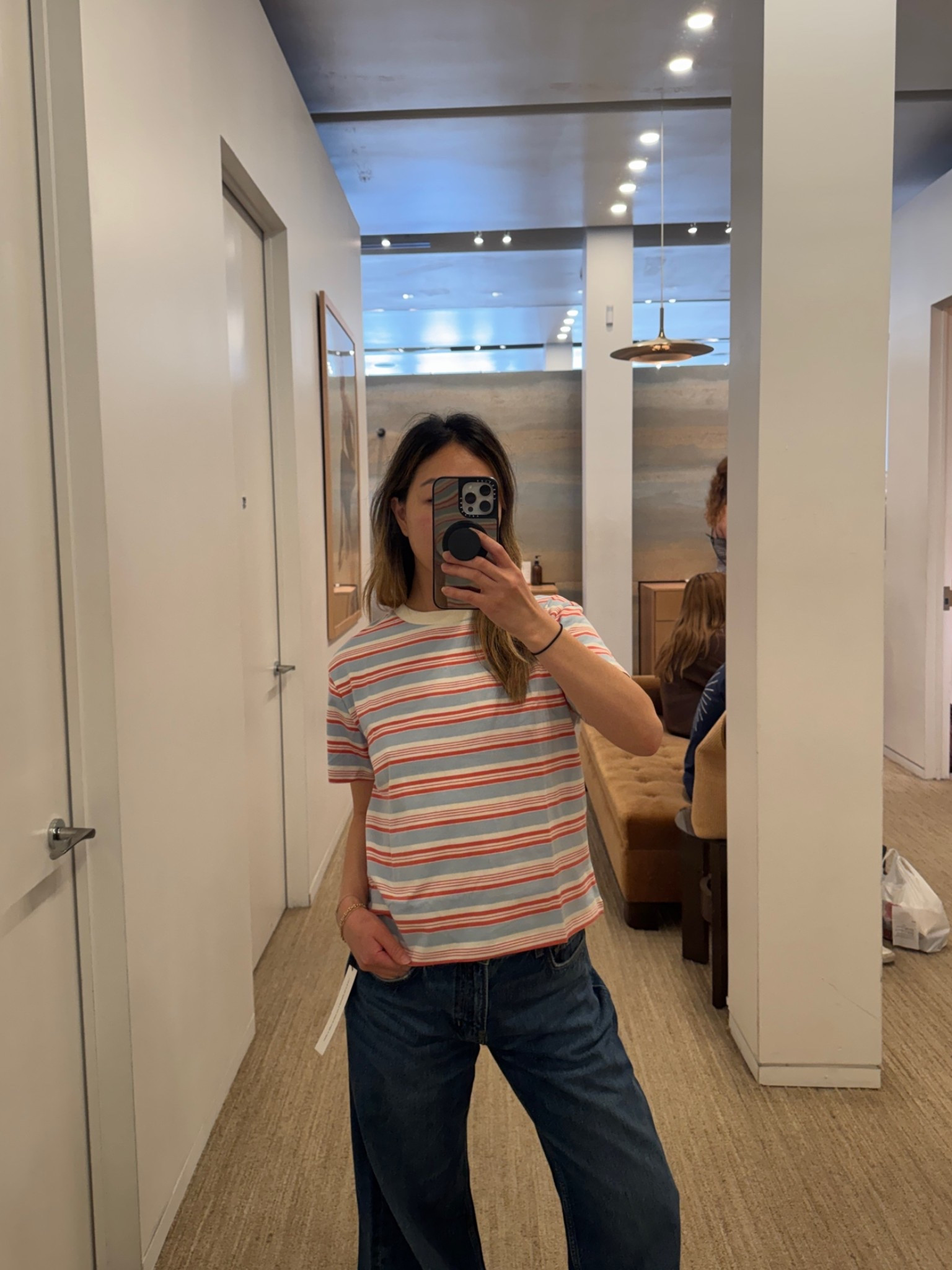 Wearing sizes XS (top) 26 (jeans)