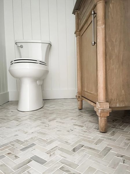 Love this Herringbone floor tile from Home Depot!

Kohler Toilet, polished marble floor and wall tile, natural wood vanity, powder room vanity, herringbone tile, coastal bathroom, powder room decor, powder room vanity, 24” vanity, bathroom floor tile.
#bathroom #homedepot 

#LTKstyletip #LTKhome #LTKFind