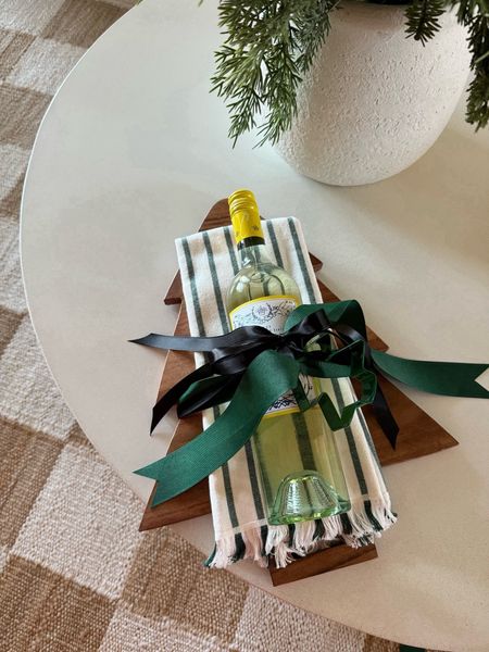 A perfect hostess gift! A cute board, pretty hand towel, a favorite wine, then top it off with a cookie cutter and ribbon! 

#LTKGiftGuide #LTKSeasonal #LTKhome
