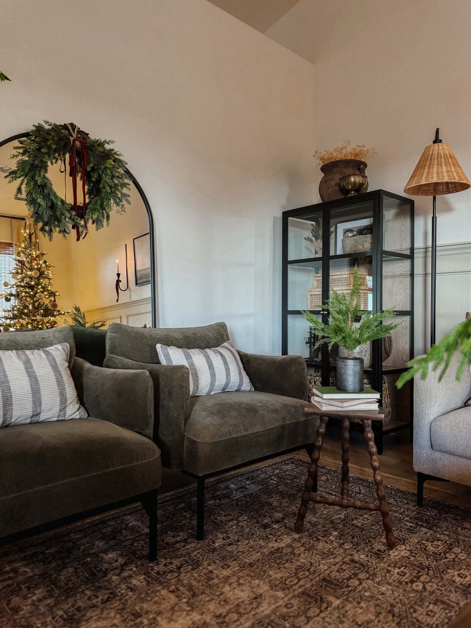 Living room inspo, Penn chairs, olive green accent chairs, custom curtains, pinch pleat curtains, floor to ceiling curtains, neutral sofa, beige sofa, west elm penn chair, green accent chair, vintage pillows, Turkish pillows, boucle pillow, shady lady tree, faux tree, greenery, Walmart floor lamp, rattan floor lamp, round coffee table, wall sconce, tapered candle holder, leather sofa, shady lady tree, loloi Sinclair rug, throw pillows, floor length mirror, arch mirror, Target home decor, affordable home, black cabinet, studio McGee cabinet, round glass coffee table, target accent table, Sinclair loloi rug, vintage inspired rug, vintage milking stool, foot stool, arch mirrorr

#liketkit #LTKsalealert #LTKstyletip #LTKhome
