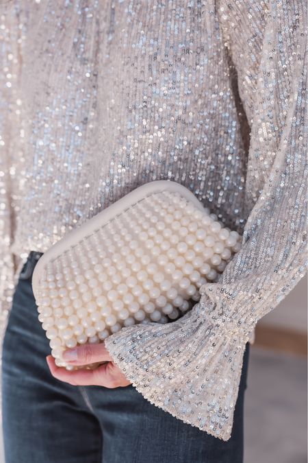 Cult Gaia makes some really special accessories and when I saw this clutch, I knew it would be perfect for the holidays! I love the look of the pearls…they’re so elegant, sophisticated, and chic. You can style this clutch with jeans and a blouse like I did, or with your favorite holiday dress, skirt, or pants.

~Erin xo 

#LTKitbag #LTKstyletip #LTKHoliday