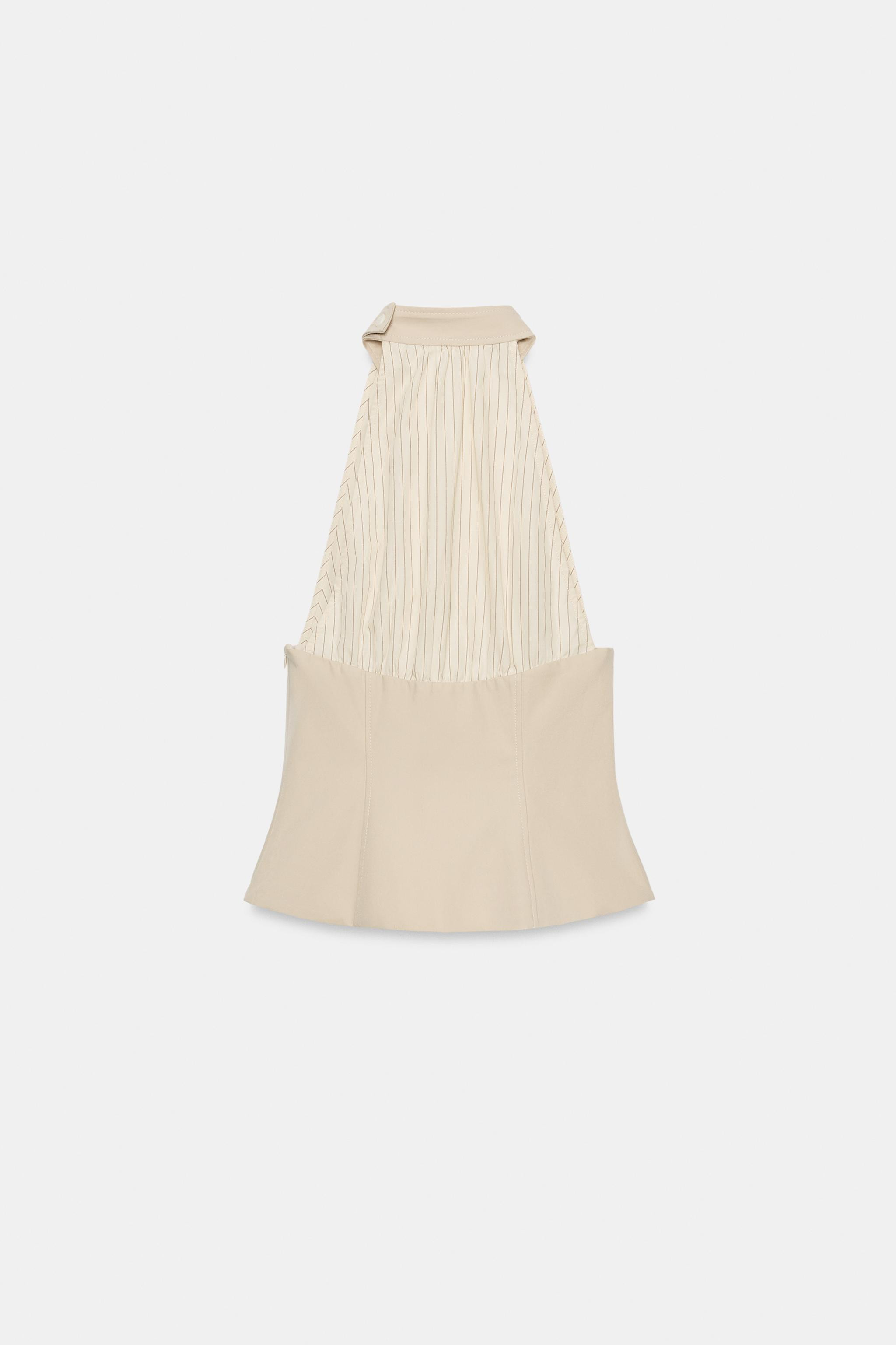 Model height: 181 cmAdjustable high-neck halter top with buttons and open shoulders. Featuring co... | Zara DE