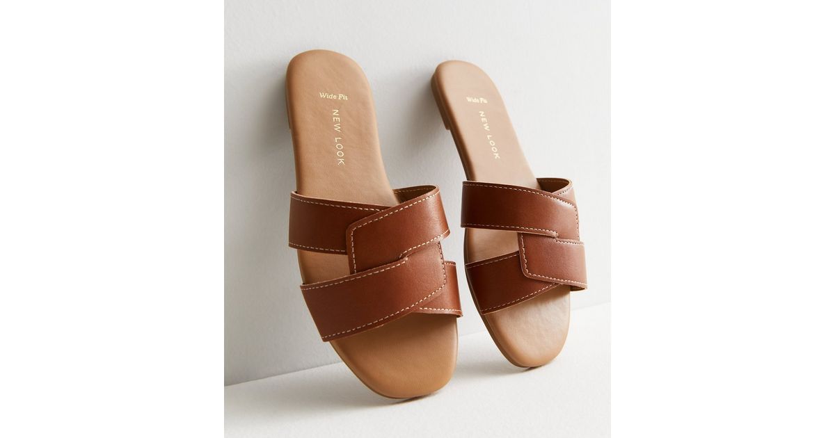 Wide Fit Tan Leather-Look Stitch Sliders
						
						Add to Saved Items
						Remove from Saved ... | New Look (UK)
