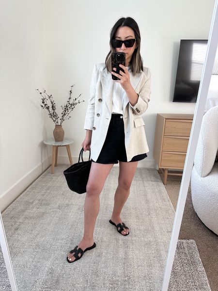 Banana Republic linen blazer. On sale! This blazer is amazing. Sized up for an oversized fit.  Agolde Dee shorts in black. Size up 2 sizes. 

Banana Republic linen blazer petite 2
Everlane Tee Medium
Agolde Dee shorts. 26
Hermes sandals 35
Dragon Diffusion tote 
YSL sunglasses. 

Sandals, jean shorts, petite style, summer style, vacation outfit. 



#LTKitbag #LTKsalealert #LTKshoecrush
