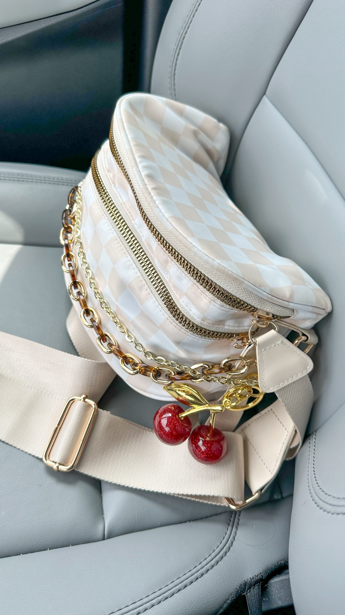 Beige checkered bum bag with tortoise chain, gold chain, and cherry charm! 🍒 beige check purse, checkered purse, purse charms, purse chains, bag chains  

#LTKItBag #LTKFindsUnder50 #LTKSummerEdit