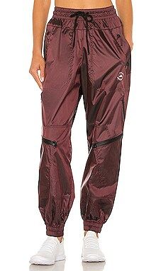 adidas by Stella McCartney ASMC Woven Track Pant in Hazros from Revolve.com | Revolve Clothing (Global)
