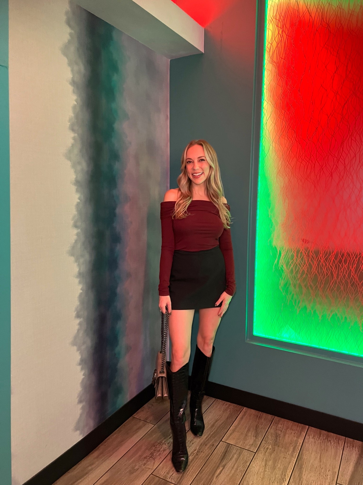 Off the shoulder burgundy top, black mini skort, black boots, affordable Amazon bag! 

#LTKFindsUnder50 #LTKFindsUnder100 #LTKSeasonal