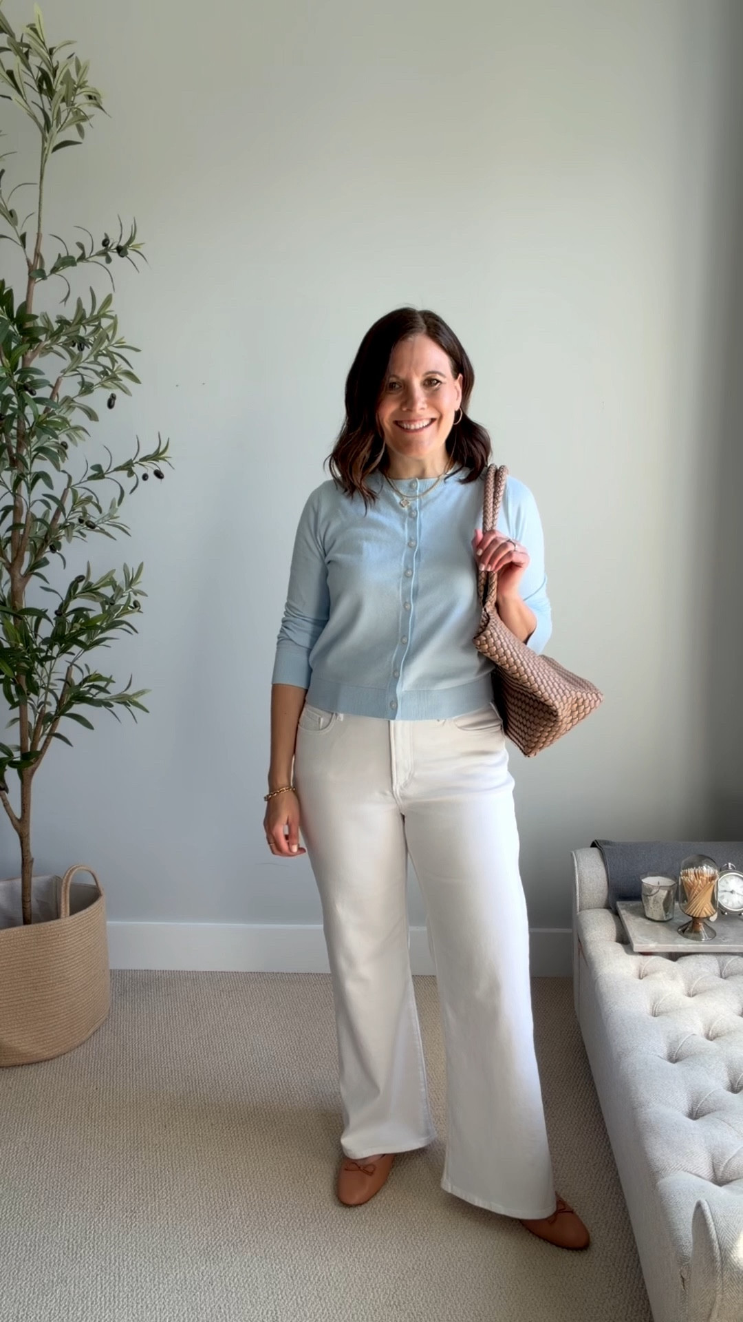 I'm so in love with watery, luminescent, and fresh light blue lately. Here I’m wearing a cardigan buttoned up like a top with wide-leg jeans. Pair a slim-fitting top with wide-leg jeans for balanced proportions. I like to wear a tank top or tee tucked in with a short sweater for extra security when I lift my arm. These jeans are from LOFT and fit true to size. Size up in this Old Navy cardigan, it fits small and short. I wear a medium if I plan to button it like a top, or a large if I plan to wear it layered.
 

 

#LTKMidsize #LTKSaleAlert #LTKOver40