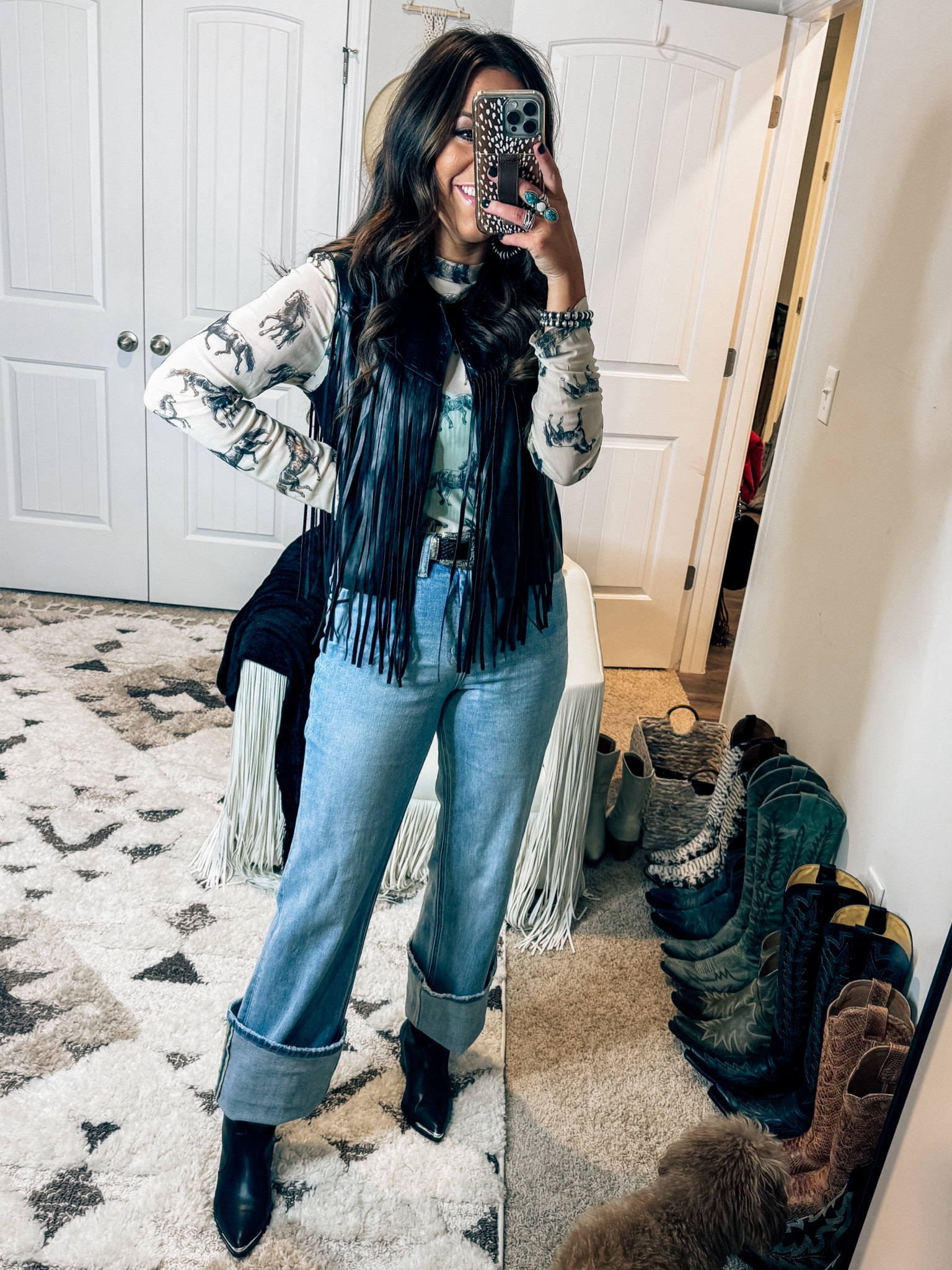 Western fashion - rodeo outfit idea - country concert outfit idea / winter - black leather boots - light wash cuffed mom jeans 

#LTKstyletip #LTKworkwear #LTKtravel
