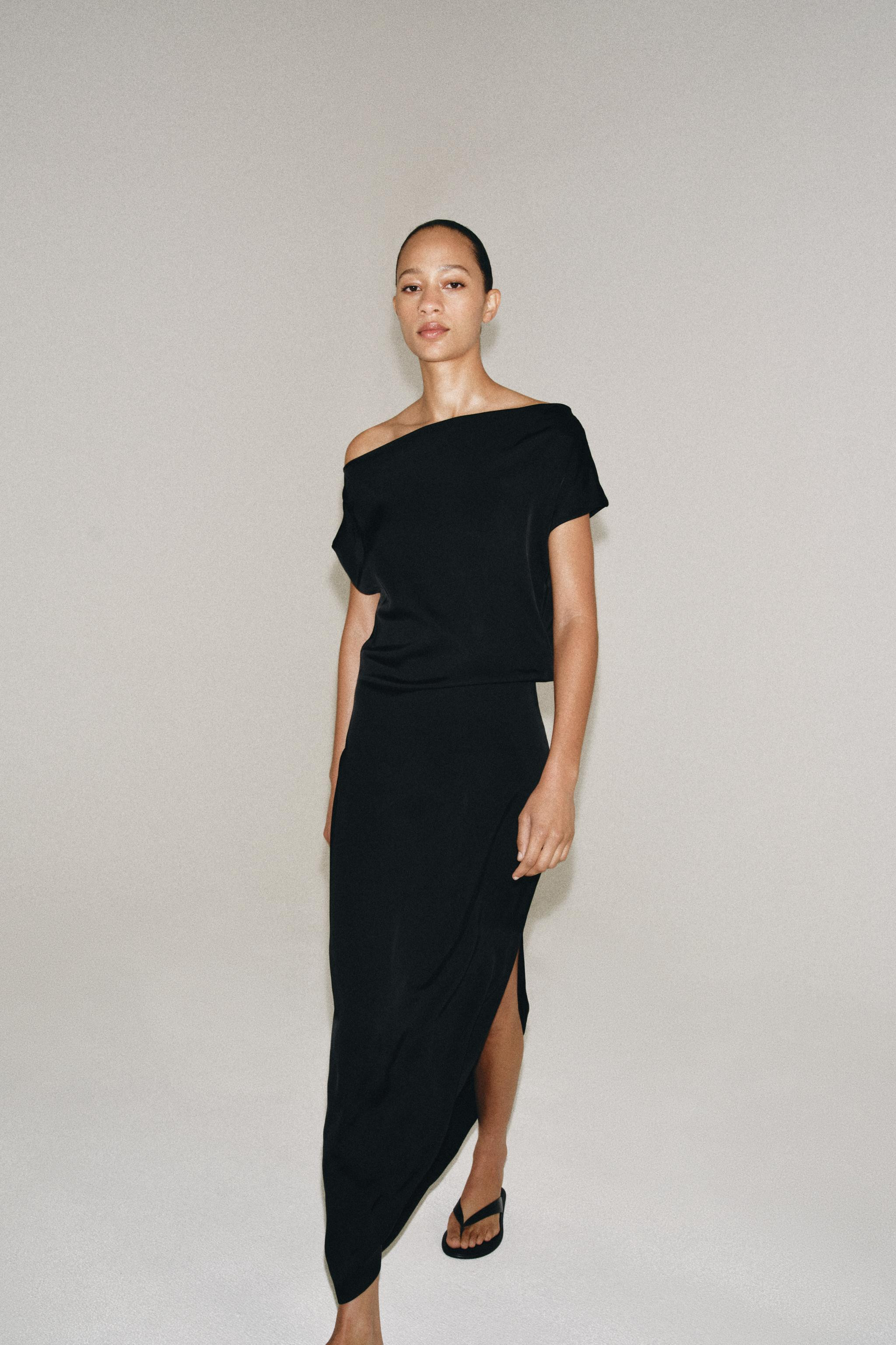 ZARA WOMAN COLLECTION. Dress made from viscose yarn. Features a fluid neckline and sleeveless des... | Zara UK