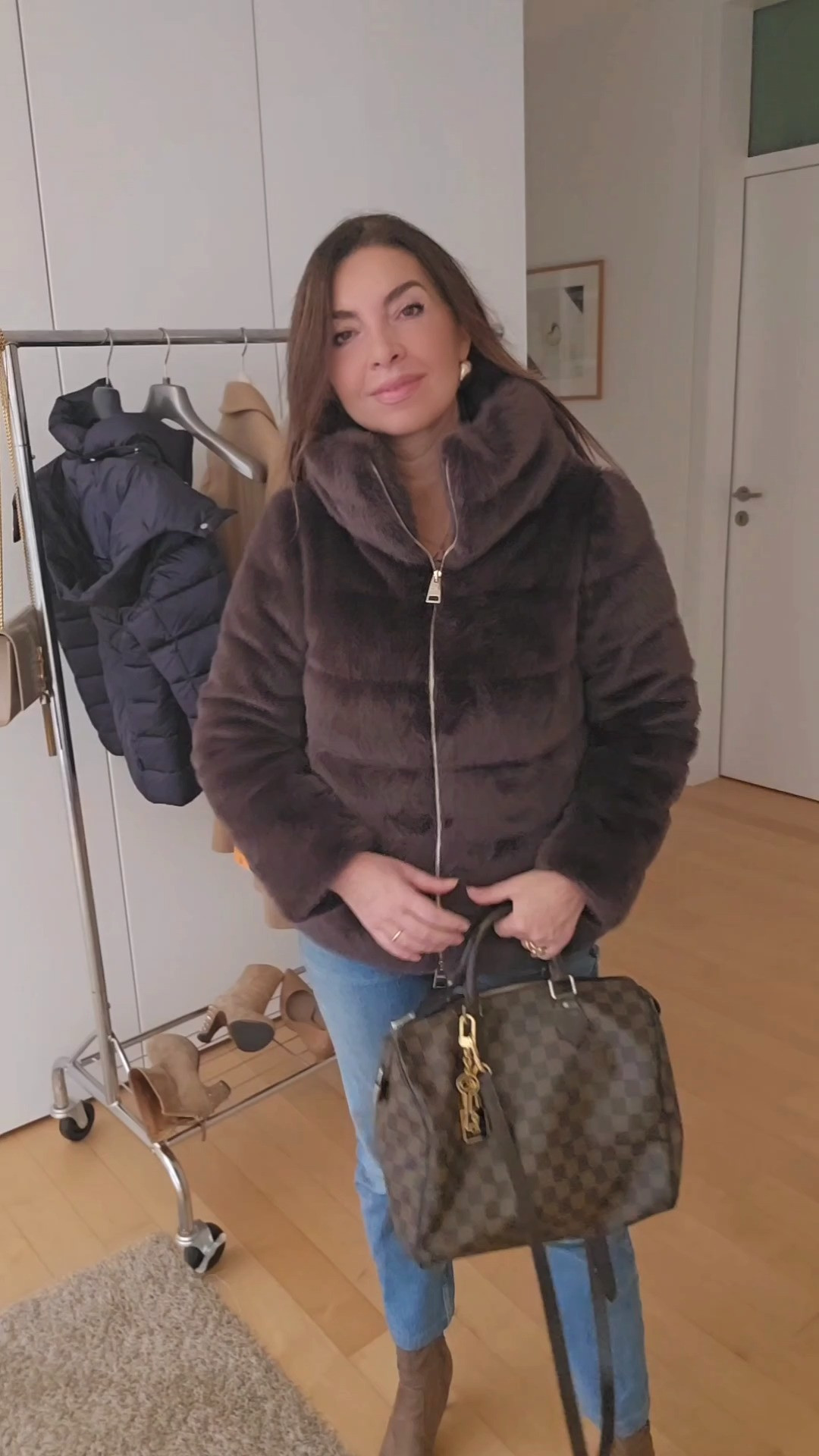 Wearing brown in winter with your Herno faux fur jacket and Levi's jeans can create a stylish and cozy look. Here are some tips:

Layer with Neutrals: Pair your brown jacket with neutral tones like cream, beige, or white. A chunky cream sweater underneath will keep you warm and create a chic contrast.

Accessorize: Choose accessories like a brown or beige scarf and a matching beanie or hat. Leather gloves in a warm tone can complete the look.

Footwear: Opt for ankle boots in brown or tan to complement your jacket. If you want to elevate the look, consider knee-high boots.

Denim Choice: Your Levi's jeans can be any wash, but a darker denim can provide a nice contrast against the brown. Skinny or straight-leg jeans work well for a streamlined silhouette.

Add Texture: Consider a knit or cable-knit sweater for added texture. It can bring warmth and depth to your outfit without overpowering the faux fur.

Bags and Belts: If you want to add another layer of brown, a structured handbag or belt in a complementary shade can tie the whole look together.

Statement Jewelry: A bold necklace or statement earrings can add a touch of glam to your outfit without overwhelming the warm tones.  

 #LTKeurope #LTKautumn #LTKstyletip