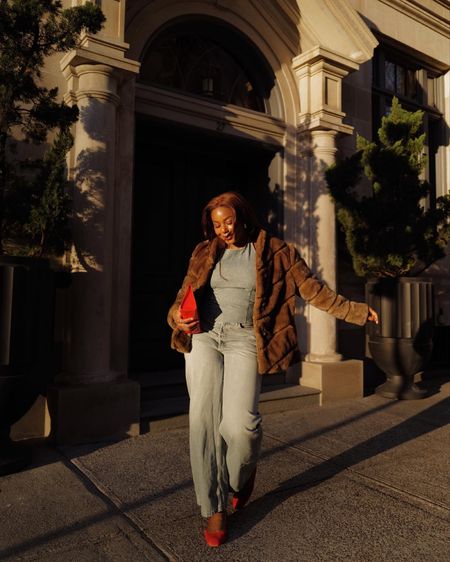 Spring transitional outfit idea - take your wardrobe from winter to spring with this outfit 

- denim halter neck top 
- oversized jeans 
- red flats 
- red oversized clutch 
- faux fur coat 

#spring #ootd #jeans #denim #transitionoutfit

#LTKstyletip #LTKSeasonal