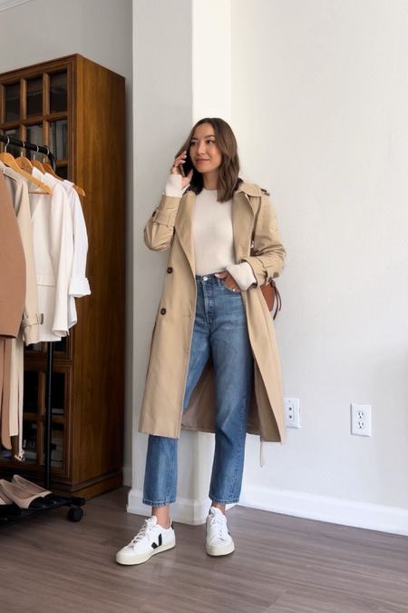 Fall outfit styling a trench coat 

Abercrombie sweater - linked to this years release 
Everlane cheeky jeans - I sized down one [on sale for under $100] 
Veja sneakers 

#LTKSeasonal #LTKsalealert #LTKtravel