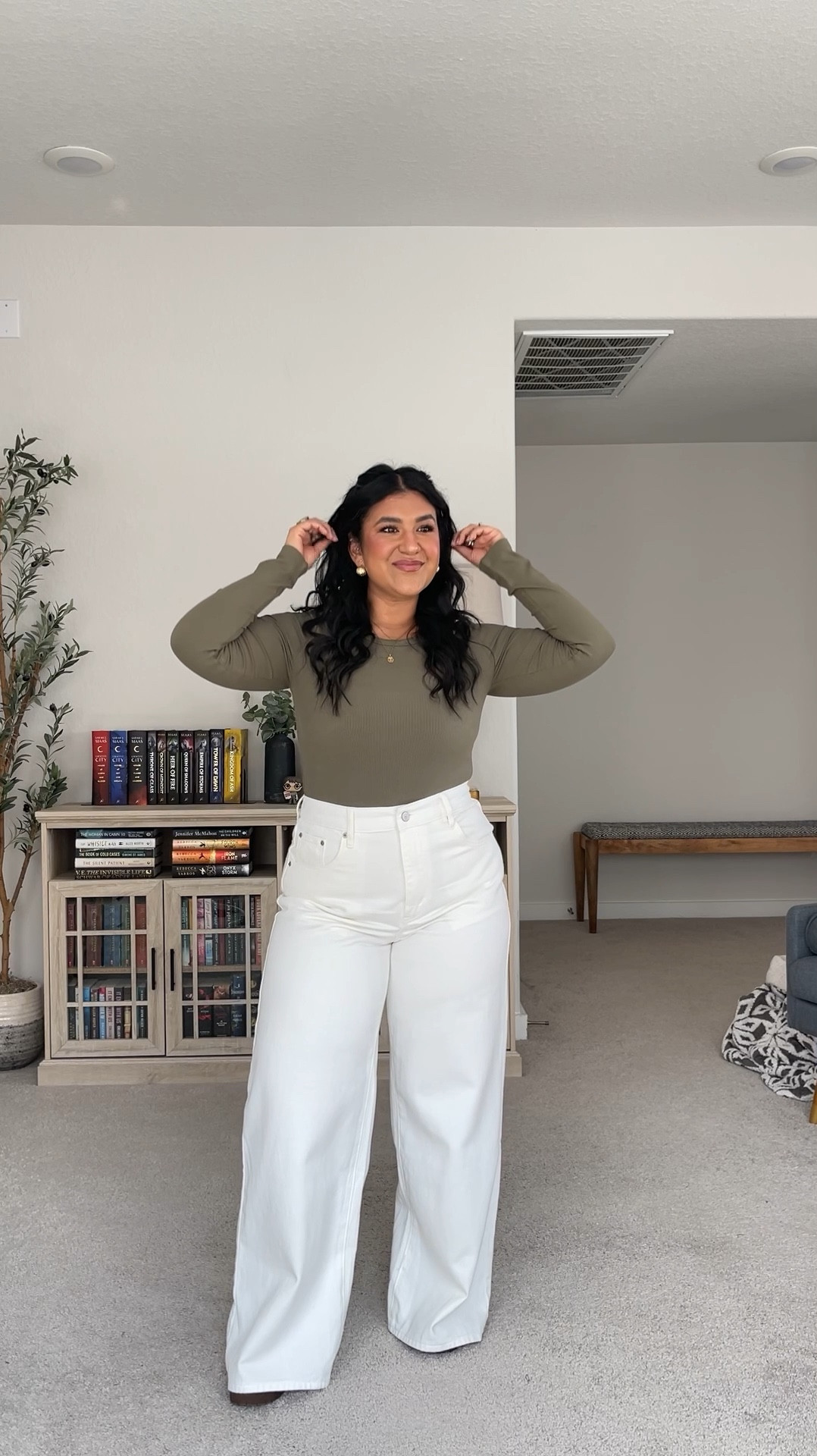 I’m 5’1”, size 12 (or a 31). I sized up to a 32 in these! These jeans are pretty true to size, but if you’re curvy or thicker in the hips and booty like me, I’d recommend sizing up one for a comfier fit. These do not have any stretch but they are a softer denim. Not stiff or rigid. They’re very high waisted and have a wide, straight leg. These are a bit long on me so I’m wearing a 2.5in boot heel. 

Wearing a large in the bodysuit and the boots are true to size. Beige lounge pants size up!! I wear the XL. 

#LTKPetite #LTKMidsize #LTKFindsUnder50