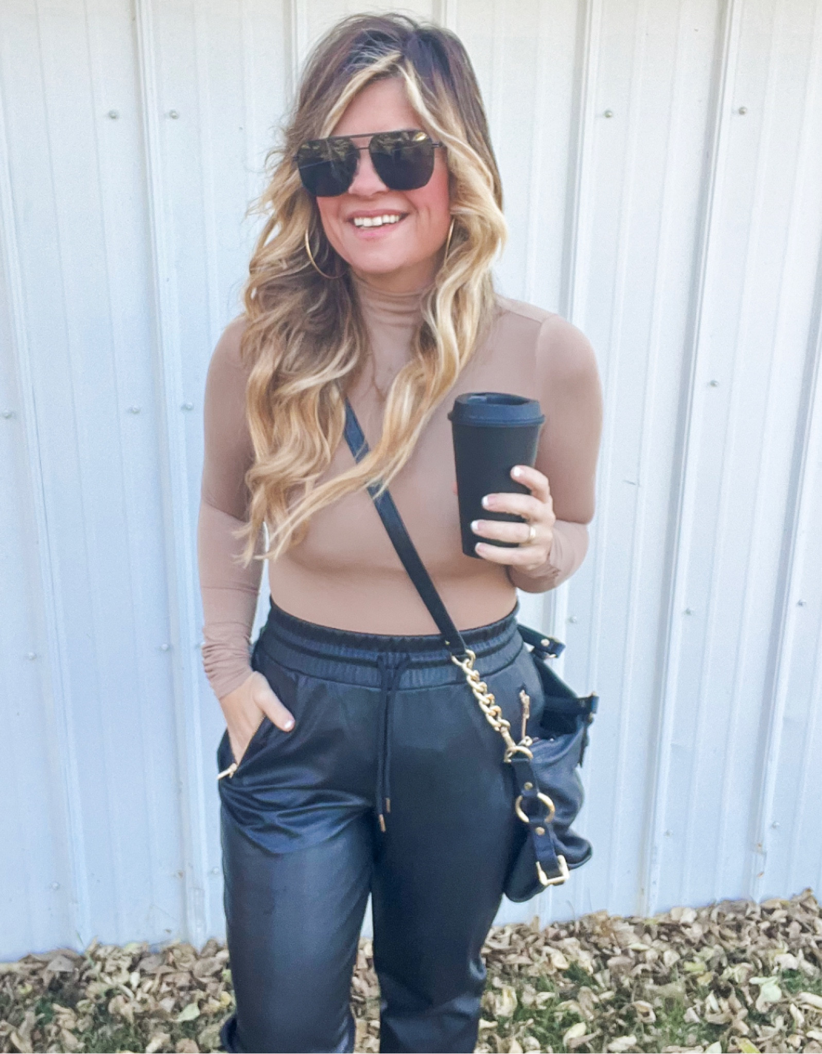 Skims turtle neck
Black leather pants
Edgy outfit ideas white leather sneakers 
Black purses
Black sunglasses

