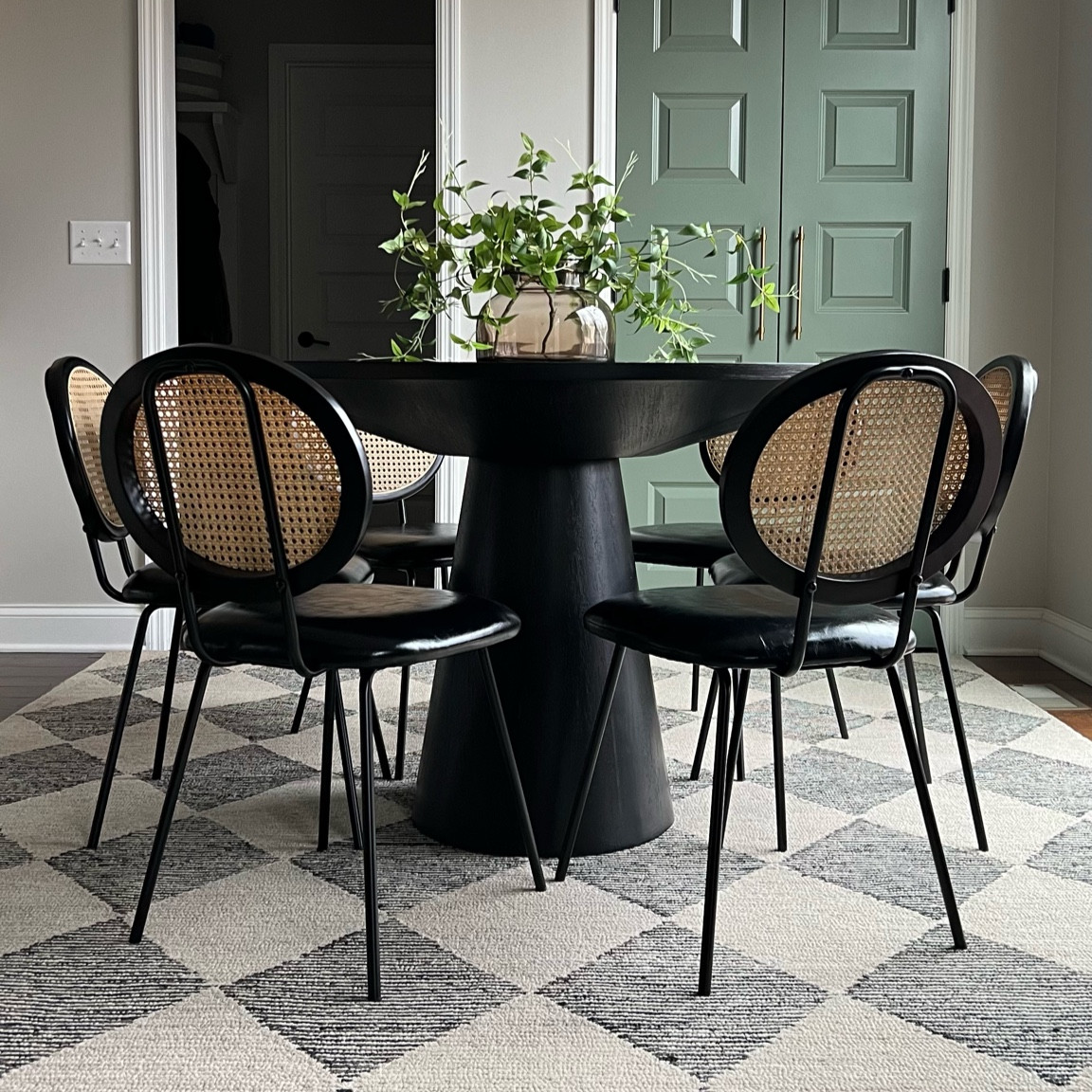 Dining room decor, round pedestal dining table, cane dining chairs, rattan dining chairs, checkered area rug, amber vase

#LTKfindsunder100 #LTKhome #LTKfamily