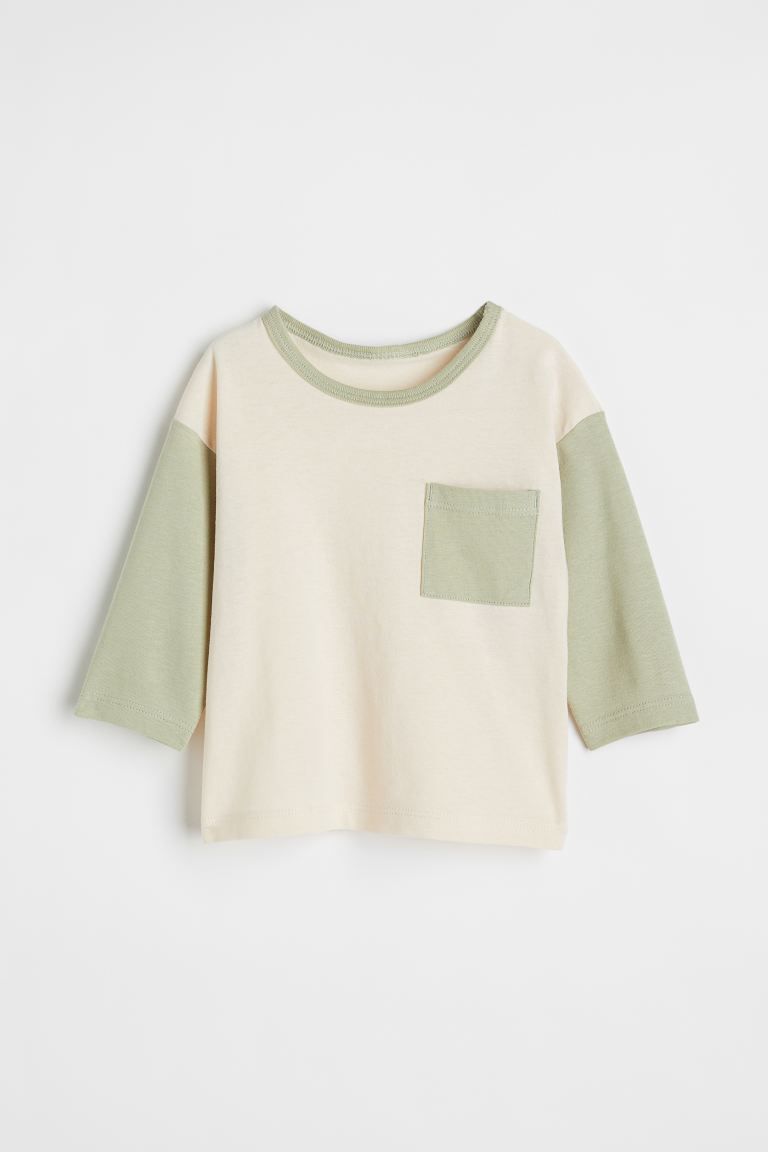 Long-sleeved shirt in soft cotton jersey. Ribbed trim at neck and snap fasteners on one shoulder ... | H&M (US + CA)