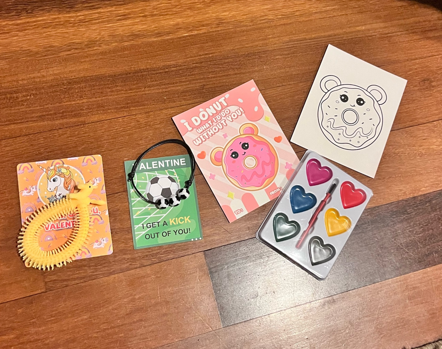 Non candy Valentine cards! A stretchy unicorn bracelet, sports bracelets, and a watercolors set with a card that they can paint! 

#LTKSeasonal