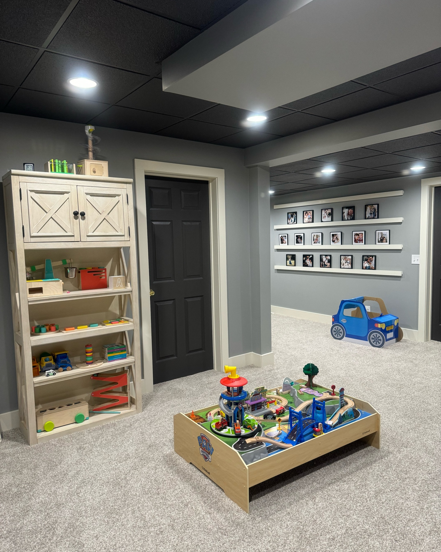 Playroom. Play table. Paw patrol toys. Bookcase. Playroom inspo. Gallery wall. Photo gallery wall. Bookshelves decor. Playroom decor. Playroom design. Basement playroom. 

#LTKhome #LTKfamily