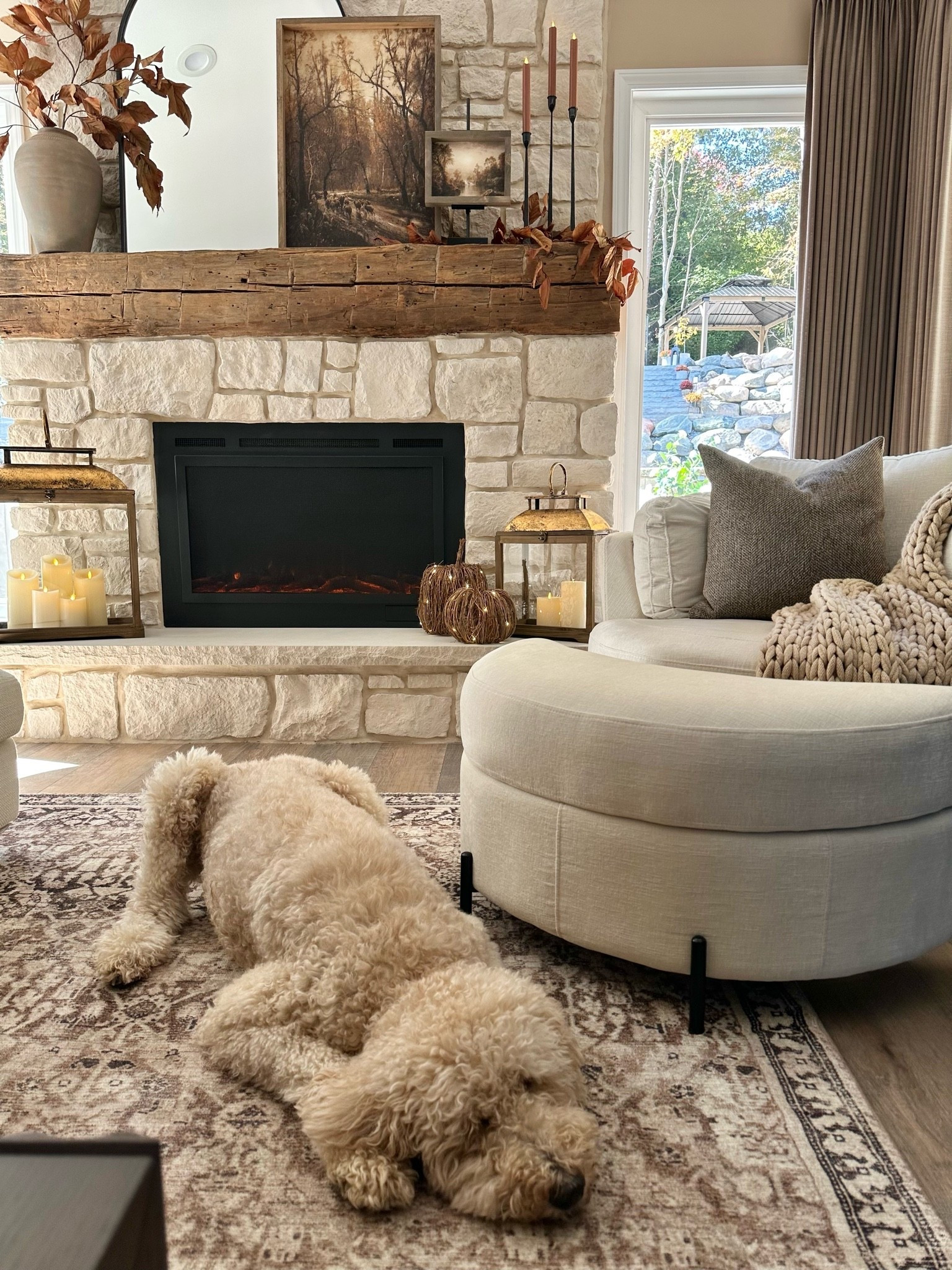 LANTERNS & COZY FALL VIEWS 🤎🍂 A little fall glow, warm wood tones, and my favorite lanterns bringing all the cozy vibes to our living room! There’s just something about flickering candlelight, layered textures, and a cozy spot by the fireplace that makes home feel extra inviting. And of course, Bella always finds the best seat in the house! 🐾

#LTKHome #LTKSeasonal #FallHomeDecor #LanternDecor #CozyHome