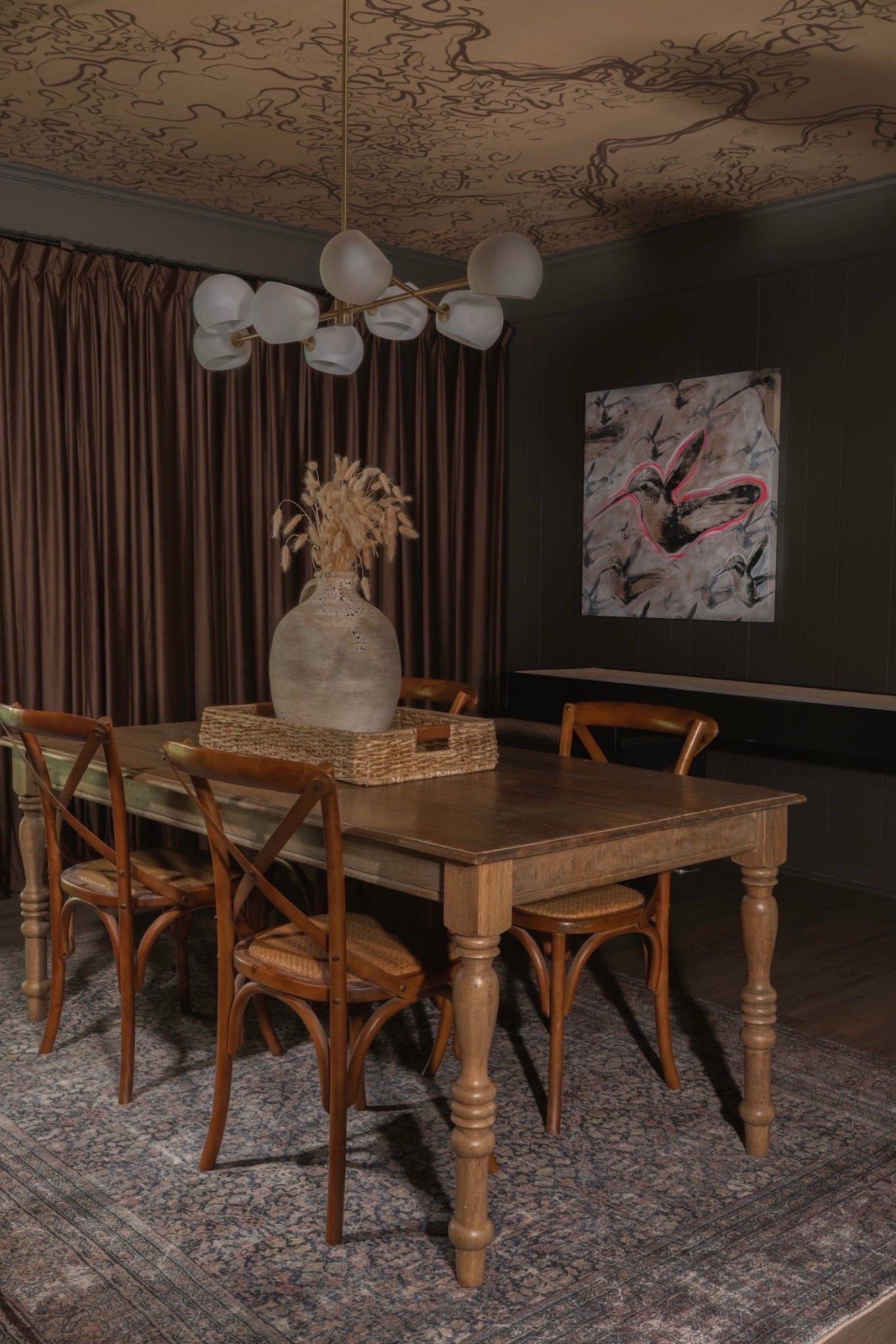 Elevated drama in the dining room ✨ This space features a wood dining table with turned legs, woven rattan chairs, a large ceramic vase centerpiece, and a woven tray to ground it all. The showstoppers? A statement ceiling mural, moody floor-to-ceiling drapes, and that modern globe chandelier that ties the look together.

#eanesinteriors #diningroomdesign #statementceiling #wooddiningtable #rattanchairs #globechandelier #moodyinteriors #vintagerug #centerpiecevase #diningroominspo #ltkhome #interiorstyling


#LTKOver40 #LTKHome #LTKvlog