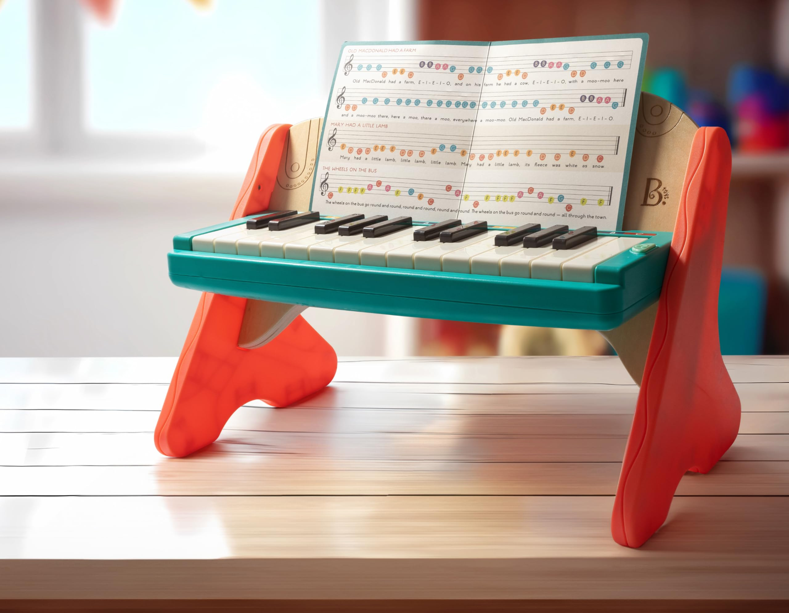 B. toys – Wooden Toy Piano for Toddlers, Kids – Color – Coded Keys with Songbook – Musical Instrument for Early Learning & Creativity – 3+ Years – Mini Maestro | Amazon (US)