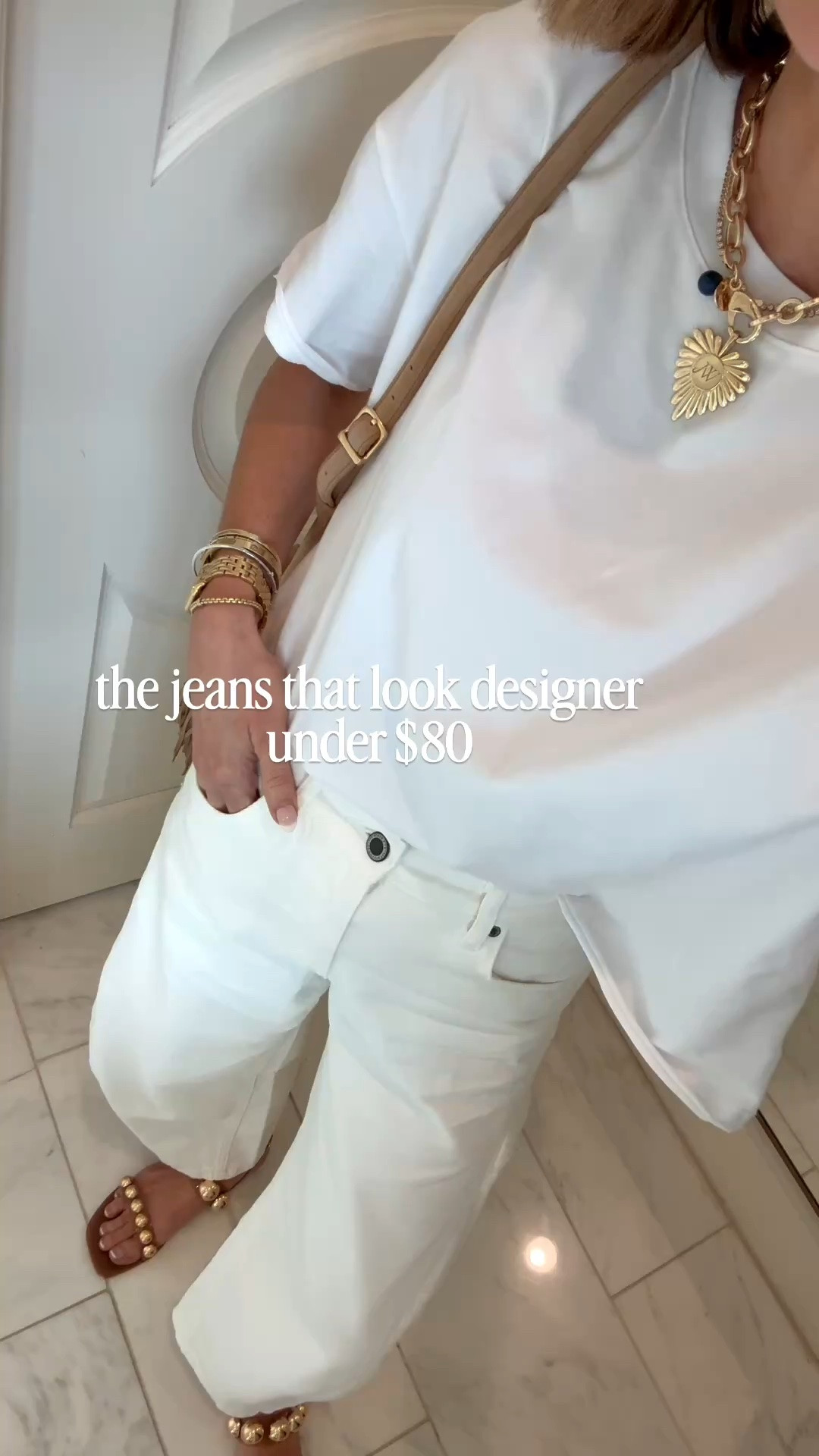 Outfit of the day is white on white with some cute brown accessories! My shirt is 23% off on Amazon and my balloon jeans are under $80 🤍

Wearing size 2 in jeans 
Small in top

#LTKootd #LTKSeasonal