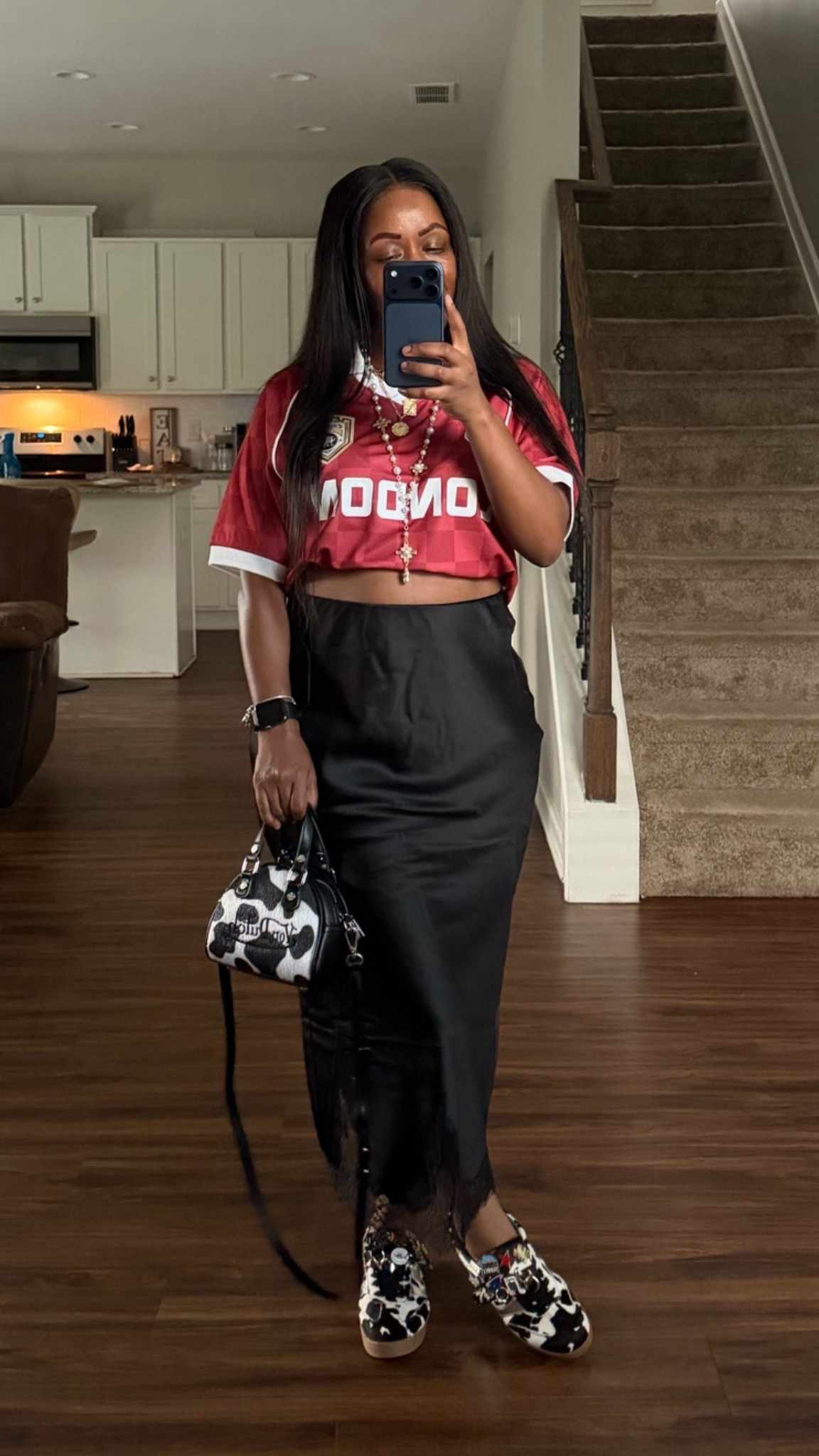 Cropped jersey outfit. I’m wearing a London jersey shirt, black slip skirt with lace detailing, cow print sneakers, and cow print purse.

#LTKootd #LTKPetite #LTKOver40