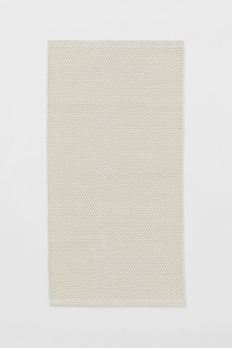 Rectangular rug in woven, textured cotton fabric. Cotton content is recycled. | H&M (US + CA)
