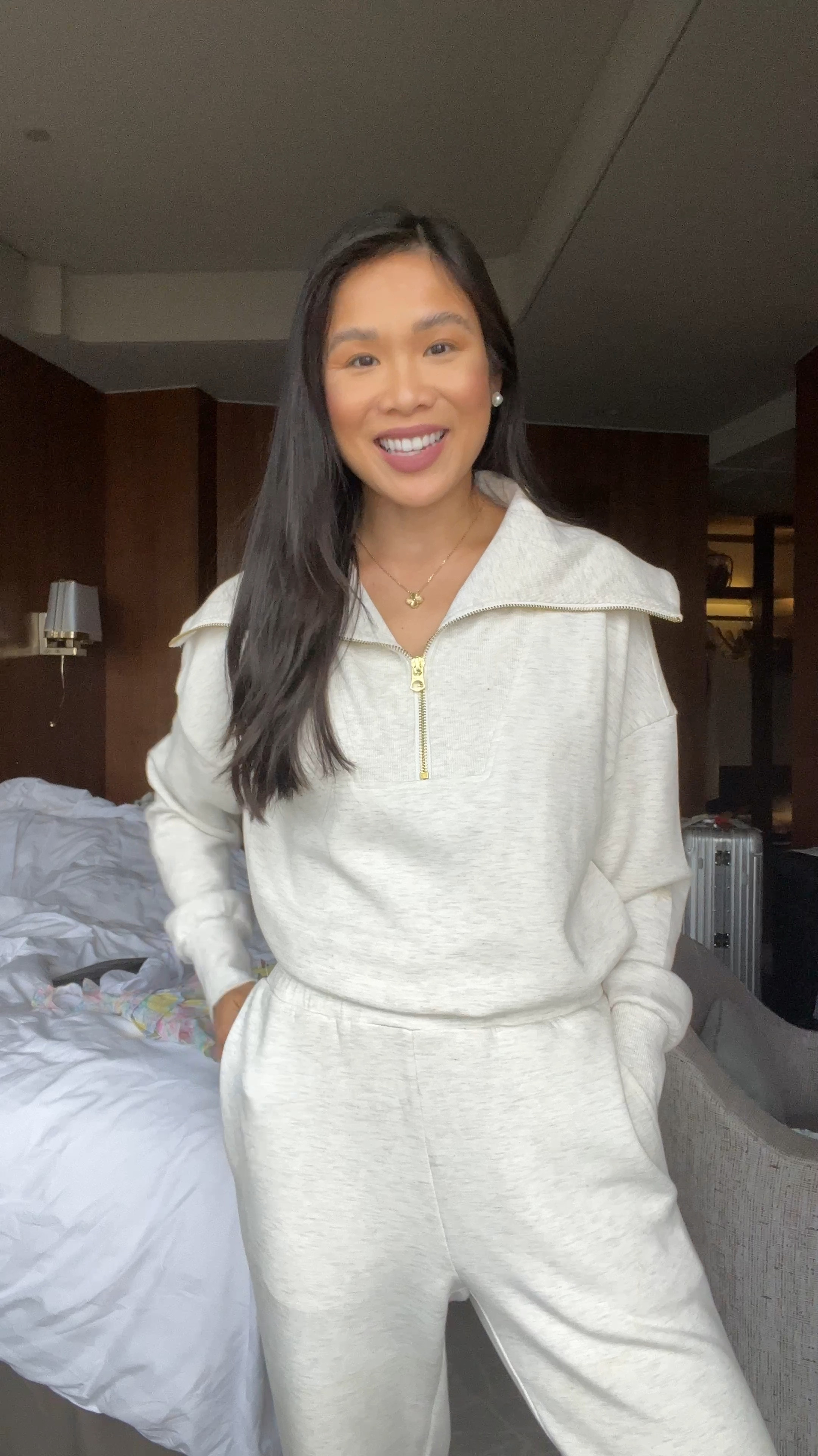 Travel outfit with the most comfortable Varley set. This material feels like butter and is so comfortable, I slept in it on the plane and our flight was more than 12 hours. Wearing size XXS in both top and bottoms, for the pants I have the 25 inch inseam. The half zip is roomy enough to be nursing friendly, too! 

#LTKTravel