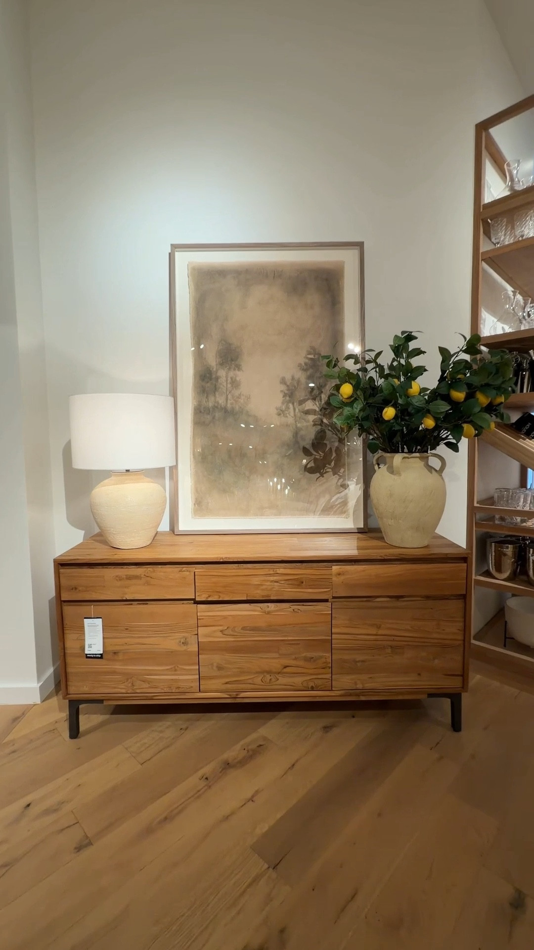 Warm, modern organic style done beautifully! 🤎 The Lakin 71” Teak Credenza from Crate & Barrel showcases the incredible character of repurposed teak wood, with rich grain and natural variation that make every piece unique. 🤩 The clean, handle-free doors keep the silhouette sleek, while the antiqued metal legs add just the right touch of contrast. ✨ With roomy drawers and cabinets for storage, it’s as practical as it is striking. Styled here beneath the “Sweet Nostalgia” wall art by Tessa Brown with a lamp and vase for a layered, thoughtful console moment. Linked this credenza and more similar storage pieces to explore. 🙌🏻 #CrateAndBarrel #Credenza #Sideboard

#LTKSaleAlert #LTKHome