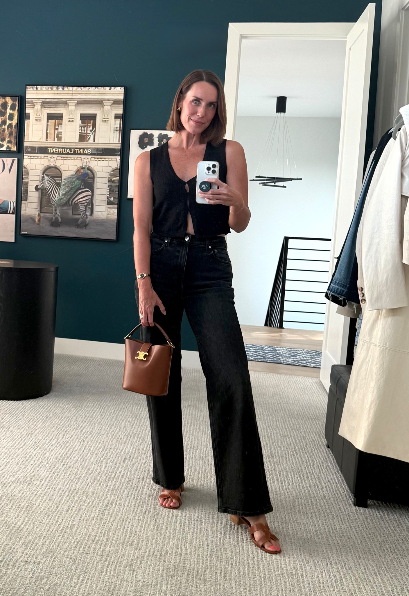 Summer night outfit. Pairing the blacks and the browns for a chic, elevated, easy breezy look. 🖤🤎 bucket bag, knit vest, trouser jeans, gold accessories, summer style