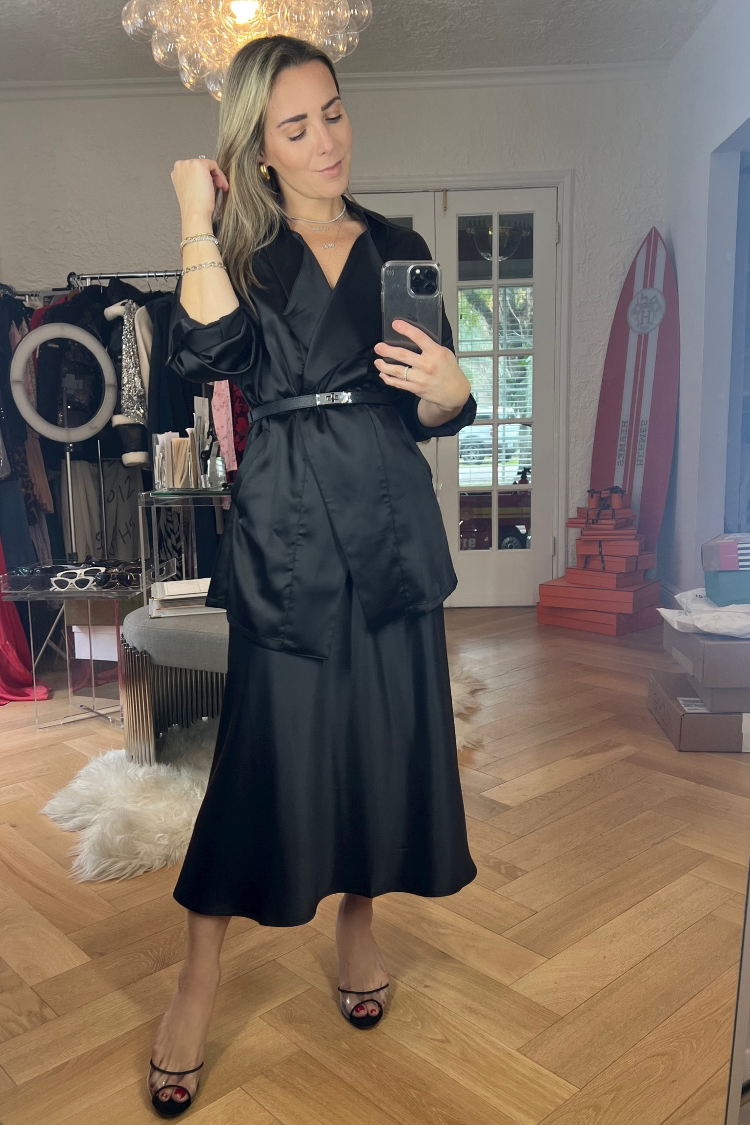 Amazon work outfit idea. Just got this new black outfit in from Amazon. The black silk skirt is so chic and on trend with the quiet luxury trend. Paired the black amazon skirt with a black silk blazer that I belted to make it look like a shirt. Wear this amazon black blazer open with a turtleneck or bodysuit underneath. Also found you a look for less of my Hermes black belt. 

#LTKfindsunder50 #LTKstyletip #LTKworkwear