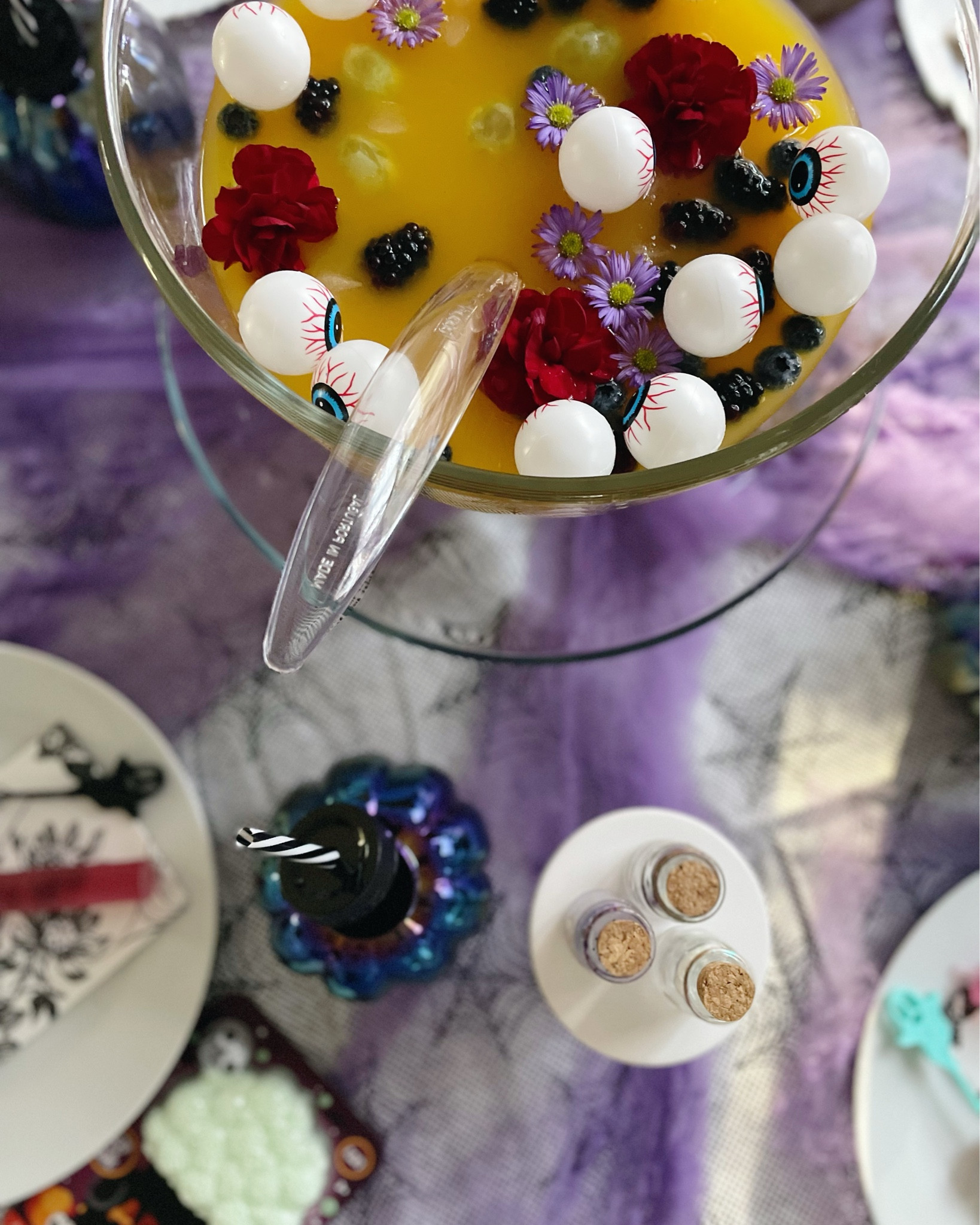 Looking for simple Halloween table setting ideas for kids? Perfect for entertaining little ones, this decor idea will make sure your Halloween party is spook-tacular! Float eyeballs in a clear punch bowl and have a syringe filled with grenadine for the kids to add some “blood” to the punch. Let them play with glow in the dark sensory foam and add some Halloween confetti. String eyeball gummies onto a cocktail stirrer and place at each setting  Find the links to all the supplies you need to recreate this look. 

#LTKKids #LTKParties #LTKHome