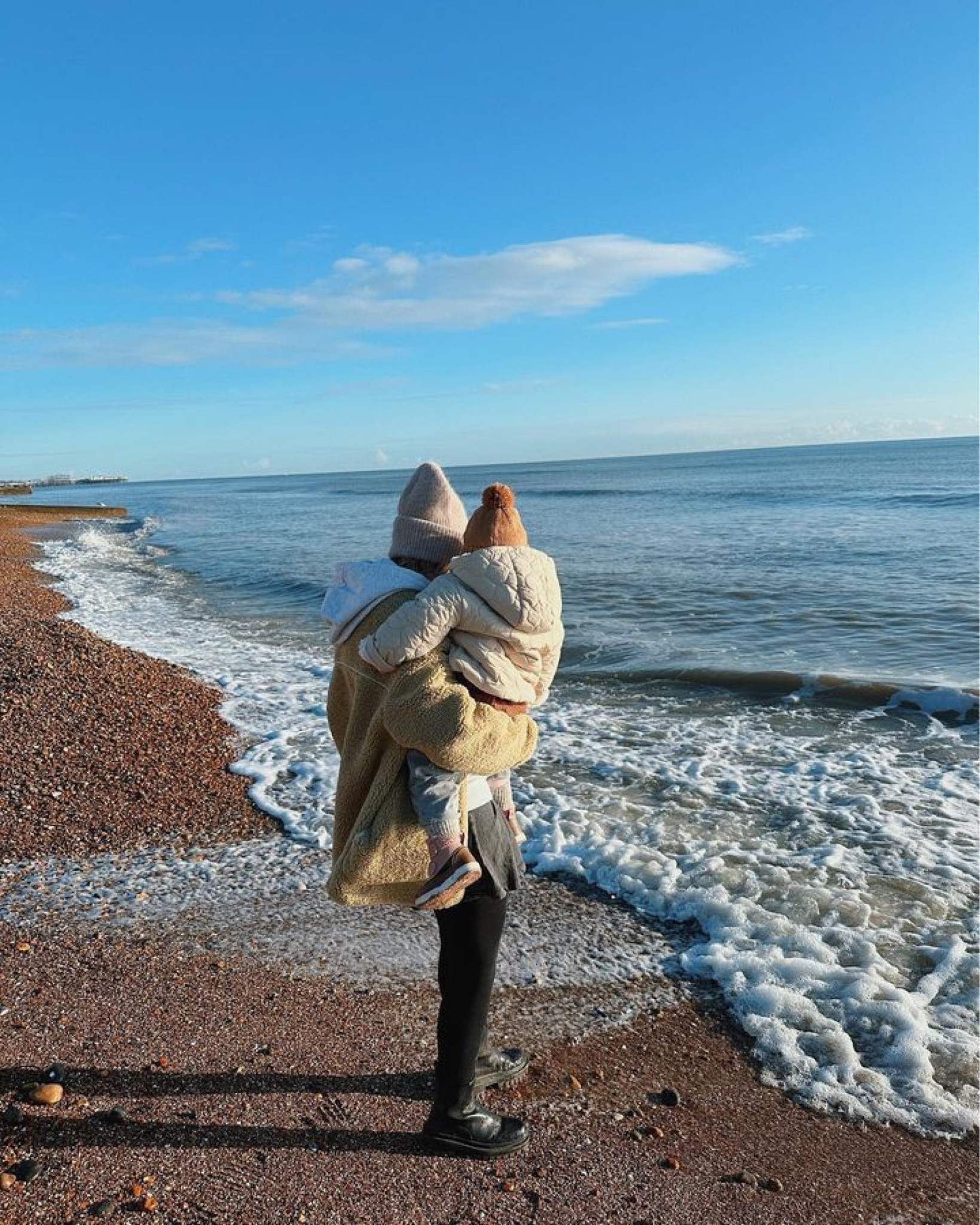 Warm fluffy jacket, grey hoodie, black trousers leggings, grey beanie, black boots, beige padded jacket, pink and brown kids boots, burnt orange beanie hat

#LTKSeasonal #LTKbaby #LTKkids