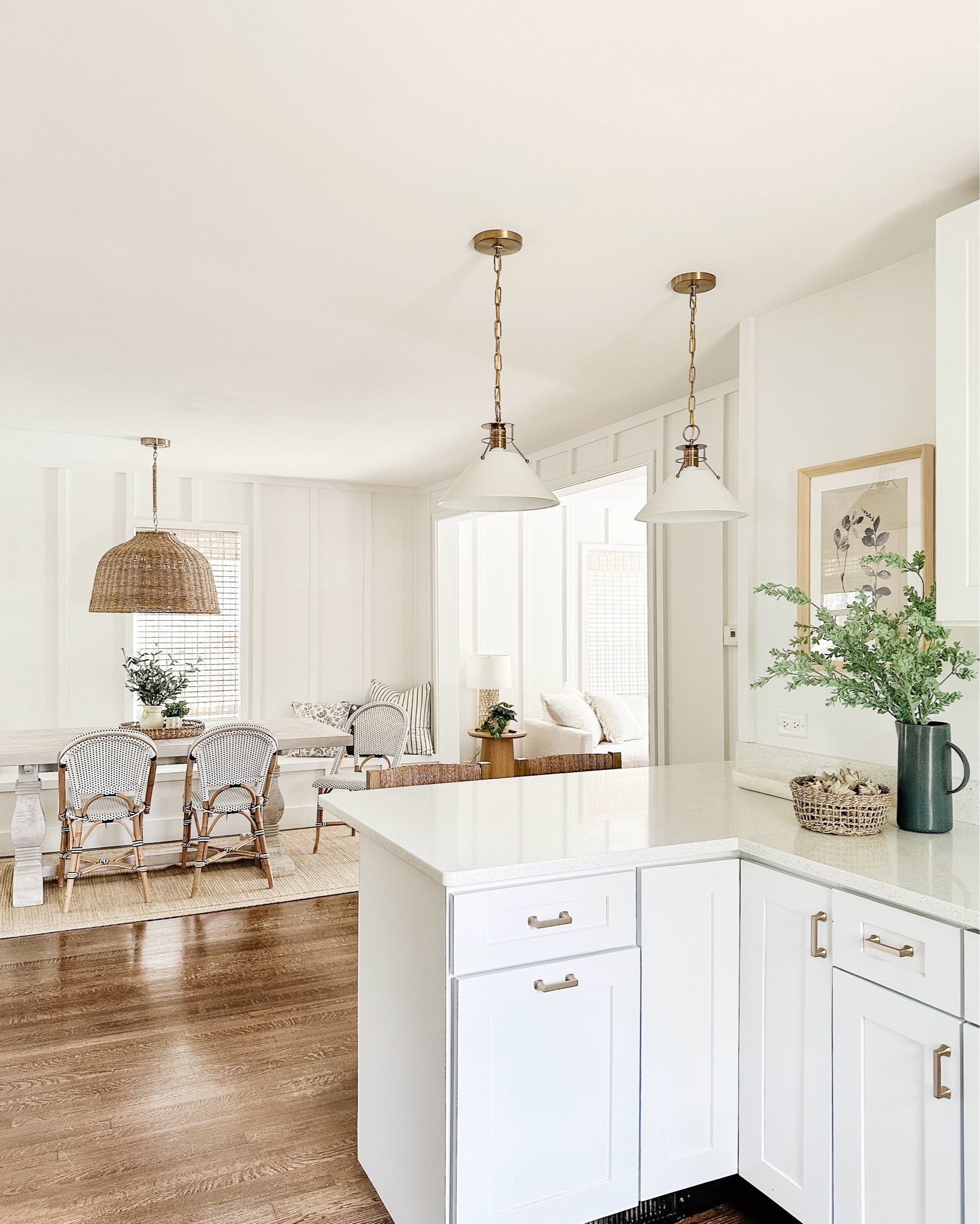 Kitchen views at the cottage✨

blue and white kitchen decor, lighting, gold and white pendants, seagrass chandelier, serena and lily french bistro dining chairs, woven rattan counter stools, blue floral wall art, white trestle dining table, target finds, coastal cottage, modern coastal kitchen#LTKFindsUnder100

#LTKSaleAlert #LTKHome