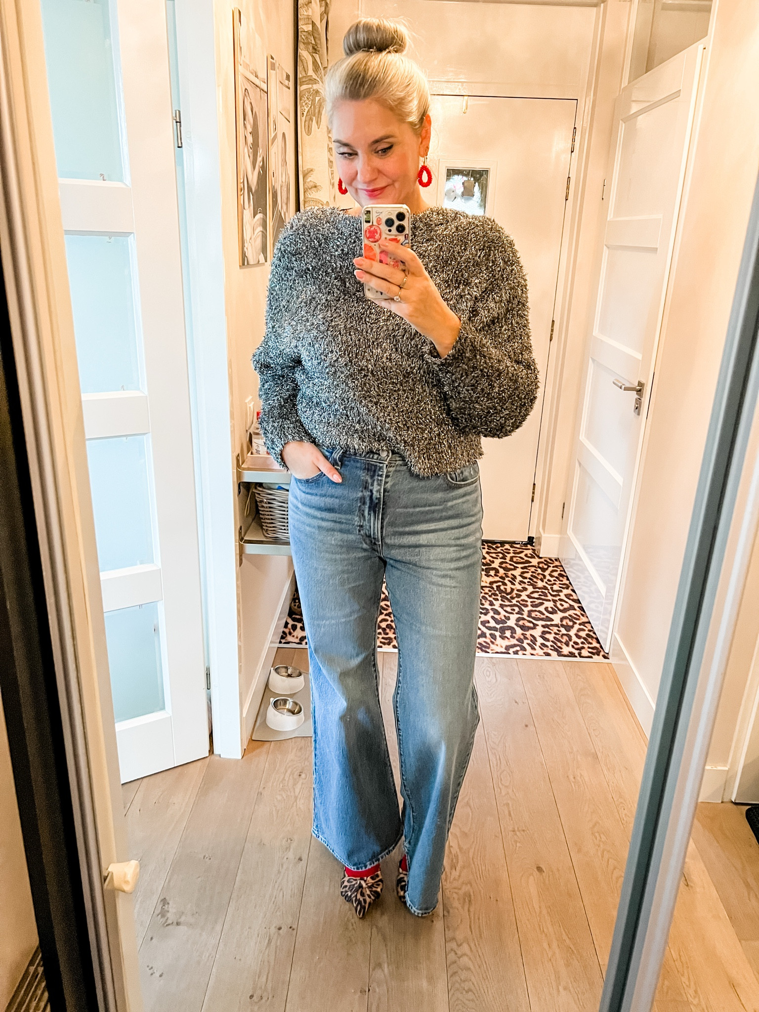 Ootd - Saturday. Silver glitter cardigan (Shoeby) turned backwards over a lace trimmed camisole paired with Levi’s Ribcage bell jeans and leopard slingback shoes (Shoeby) with bows and red socks. Red earrings. 

#LTKeurope #LTKwinter #LTKpartywear