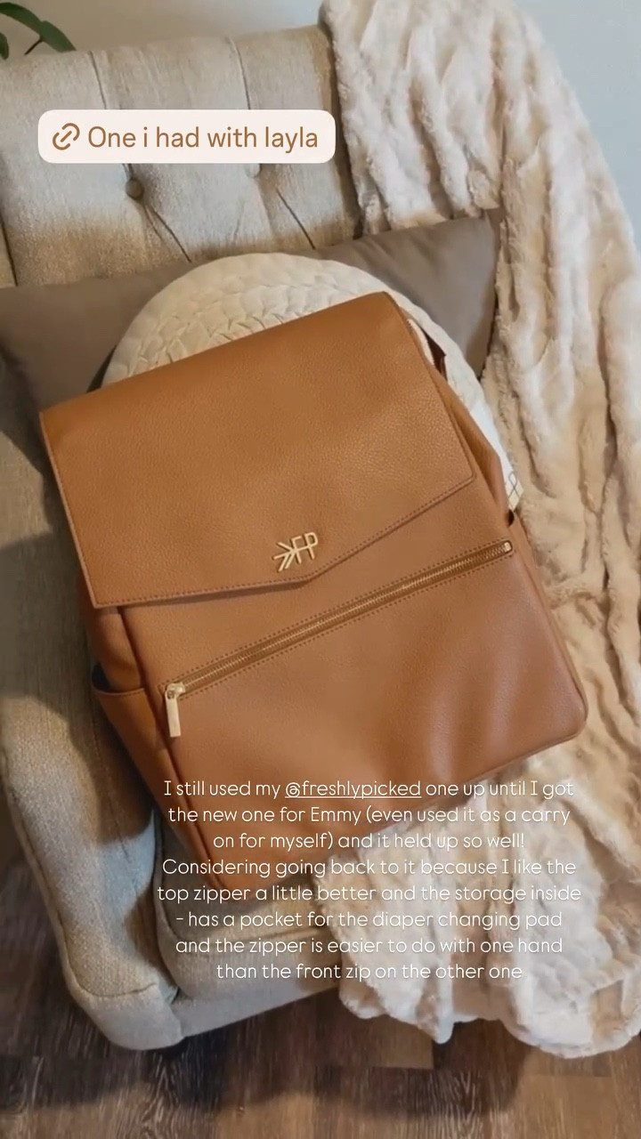 I still used my @freshlypicked diaper bag up until I got the new one for Emmy (even used it as a carry on for myself) and it held up so well! Considering going back to it because I like the top zipper a little better and the storage inside - has a pocket for the diaper changing pad and the zipper is easier to do with one hand than the front zip on the other one // diaper bag mom of two 

#LTKBaby #LTKBump #LTKKids