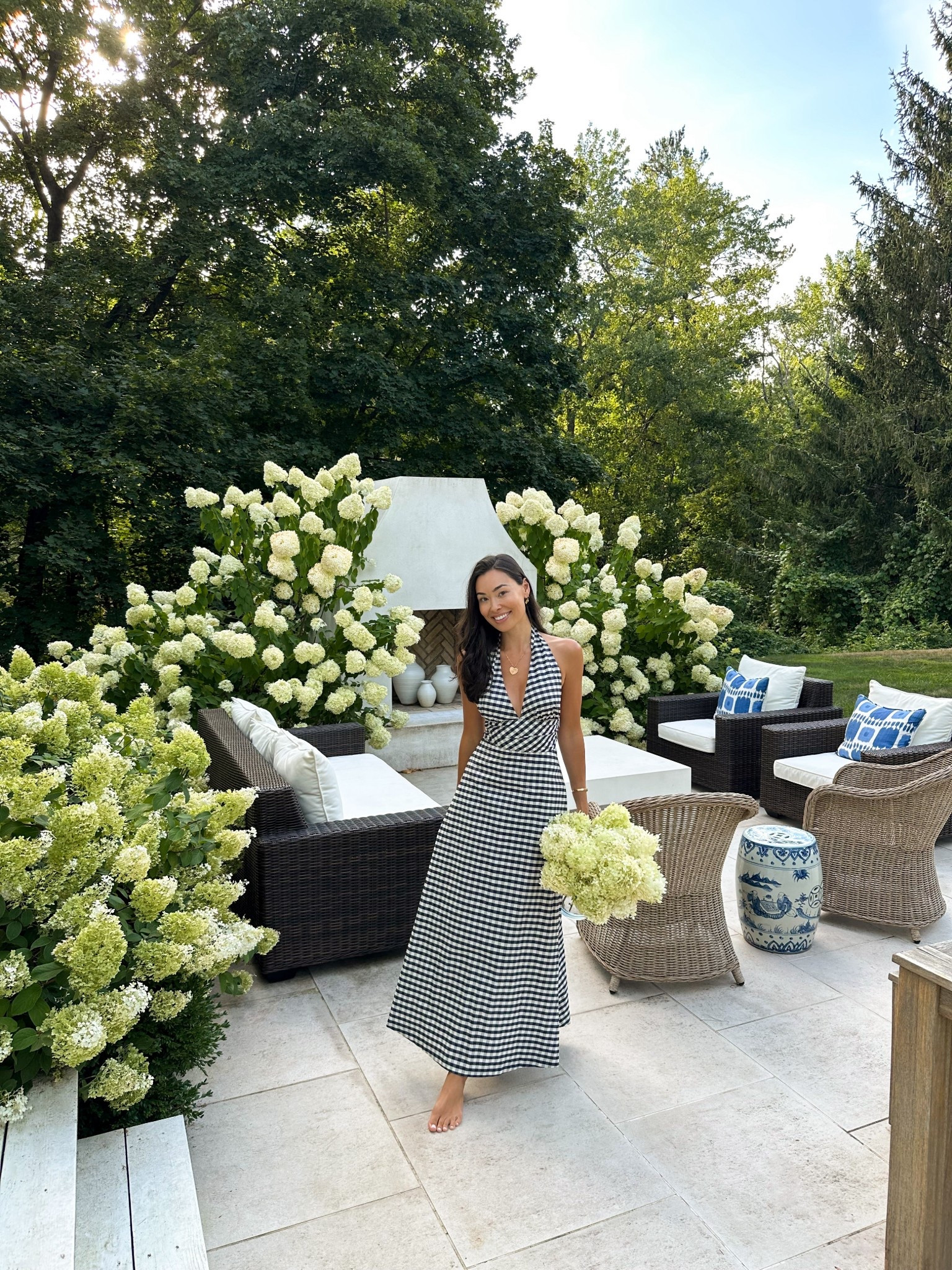 Kat Jamieson wears a gingham dress Labor Day Weekend. Summer fashion, Connecticut, outdoor furniture, patio, backyard decor, wicker chairs. 

#LTKSeasonal #LTKHome #LTKStyleTip