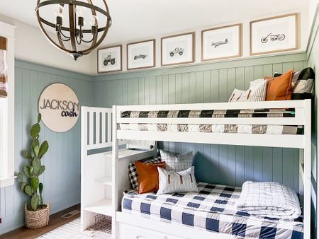 Big boy room! My sons bedroom blue vertical shiplap panels custom vehicle prints bunk bed beddys Buffalo check bedding throw pillows ticking stripe and leather boutique rugs area rug bamboo wood shades blinds wood orb round light fixture chandelier lids spaces nursery inspiration 

#LTKstyletip #LTKhome #LTKkids