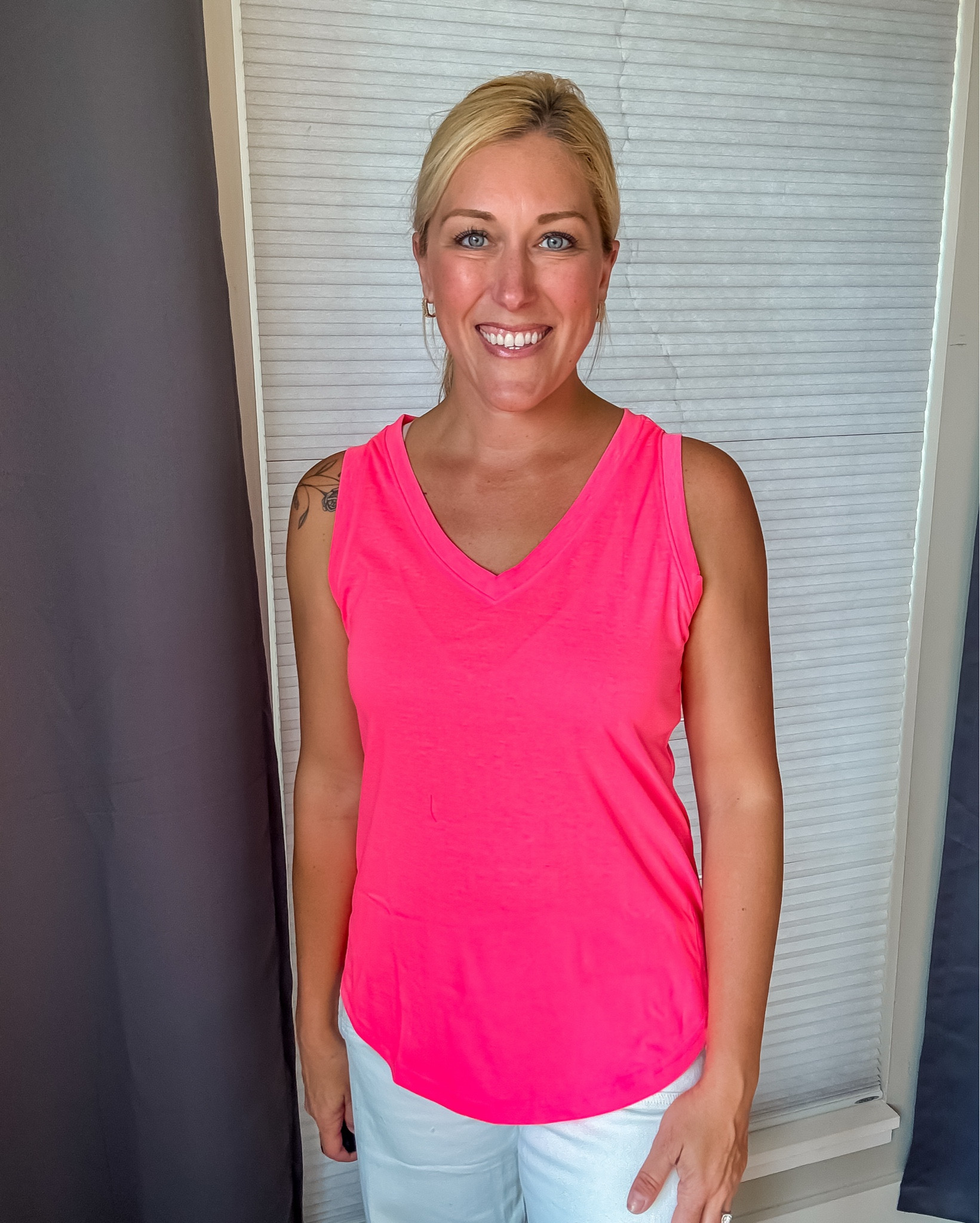 This neon pink sleeveless top is a summer standout — with a pretty  V neckline and flowy fit that flatters and feels amazing all day. Style it solo or layer it up for endless outfit options! #LTKsummer #neonstyle #pinktop #boldbasics #LTKunder50 #effortlessfashion