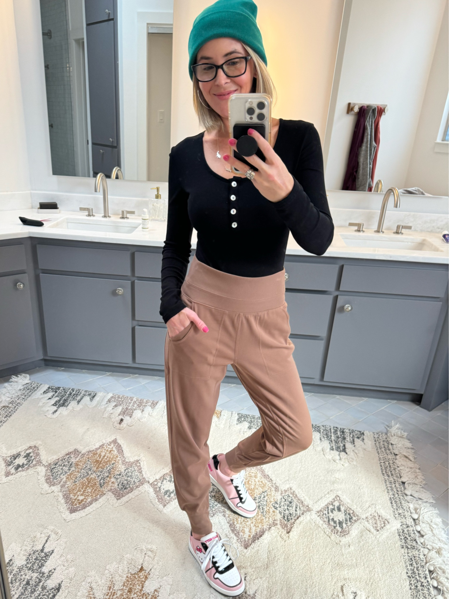 So stoked about my outfit today! 😆 It’s comfy and fun! I’m feelin’ cool in my 40s! I am wearing my favorite Athleta joggers in an XS. I would definitely size down as they run REALLY large. I am also wearing a black Mangopop ribbed bodysuit in Small - I love the fit and feel of these ribbed styles. I am also wearing a NEW pair of Hello Kitty shoes from Walmart. How CUTE are these?! I did size down in them based on the reviews and I’m glad I did as they do seem to run a bit large. I got an 8 instead of my typical 8 1/2.”

#LTKstyletip #LTKfindsunder50 #LTKover40