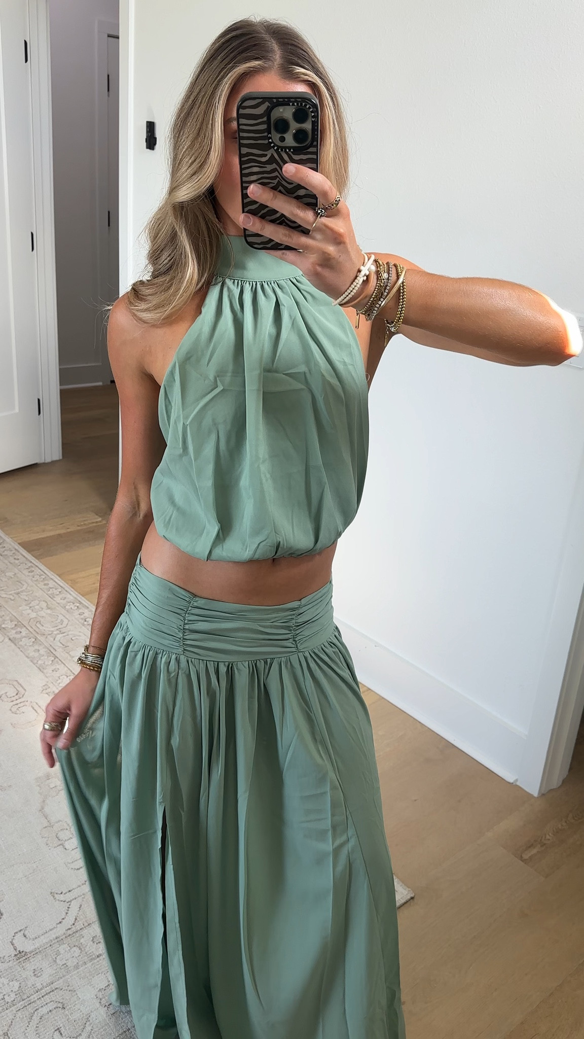 Showpo size 2. The gathered yoke defines your waist, then falls into a soft, elongated skirt that flatters every body, because effortless confidence looks good on everyone. Easy to dress up or down, it’s your go-to for brunch, dates, and dance floors.
Slip into the Melanie Maxi Skirt when you want comfort that still reads polished. The fluid movement and high-rise feel give legs-for-days energy, while the versatile hue pairs back with your favorite Skirts staples. Style it with a fitted crop or a sleek bodysuit and minimal heels for a streamlined vibe, then switch to a relaxed tee and sandals for off-duty cool.
Melanie is made for mixing, matching, and owning your moment, no matter your shape, size, or mood. Wear it your way and feel amazing from first wear to repeat outfit wins.
A sleek tie-up neckline and clean, body-skimming fit create a flattering silhouette that moves with you from desk to drinks. The open shoulder moment adds a little drama, while the cropped length makes it perfect for high-waist pairings. Confidence-boosting, versatile, and made to mix with your favourite Tops rotation.
The Melanie Top keeps styling simple: pair with tailored pants for a polished vibe or a flirty mini for weekend plans, your call, your curves, your colour. Designed for every body and every mood, it’s the pop of green that lifts any look and lets you shine.

#LTKootd #LTKWedding #LTKSeasonal