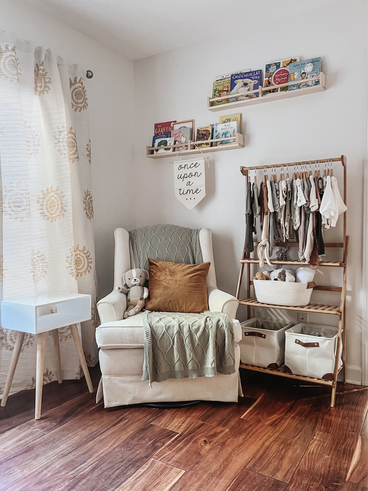 My neutral baby nursery picks for our reading nook and small space clothes display area. Books are on wall shelves and make cute display! We don’t have a closet in this room so we’re using a dresser and this wooden stand for clothes and storage. 

#LTKunder50 

#LTKhome #LTKkids