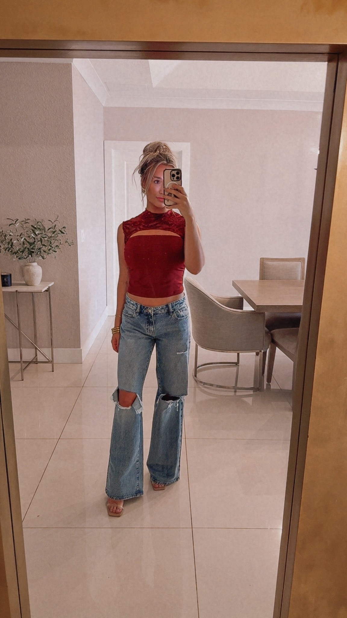 The only jeans I’m wearing at this point… truly wash and repeat. And this top is from Amazon and I'm obsessed (ordered in black too). 😍

Low Rise Jeans: Run large. I’m in a 23 and they’re still semi-baggy (which I love).

Top: True to size — wearing a small. Super flattering even for larger chests. Double lined! Thick thick material.

Heels: My go-to nude heels are linked too. Perfect height and match everything.

jeans outfit. wide leg jeans. baggy jeans. Low rise jeans low rise denim. denim outfit. fall outfits. holiday casual outfit. thanksgiving outfit ideas. christmas casual outfit. red top outfit. date night outfit. girls night outfit. flattering top. best jeans. amazon jeans. amazon fashion finds. nude heels outfit. ltk fashion. everyday style. comfy denim.
