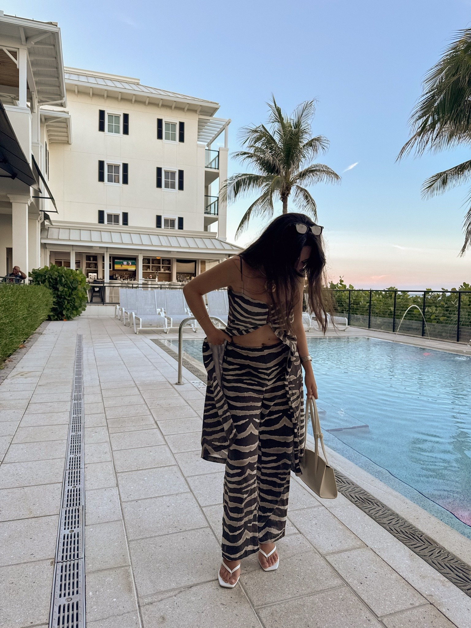 A matching set that does all the work 🦓🤎 The zebra print + flowy silhouette is such a fun take on resort wear, and I love how the longline top gives it a little extra drama. Styled with white sandals, a neutral bag + statement jewelry for an easy vacation dinner or sunset drinks look.

#LTKootd #LTKSeasonal #LTKTravel