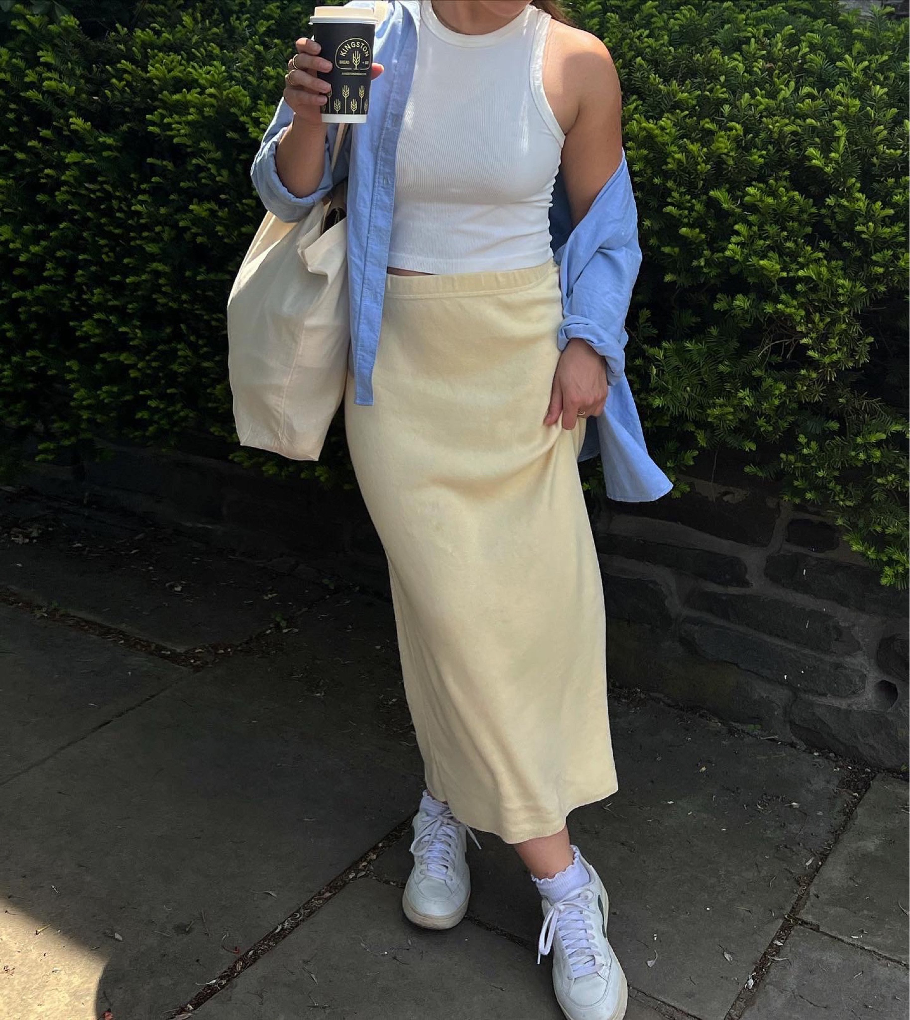Spring fit!! Yellow midi skirt, linen button down, white sneakers. Spring streetwear, simple spring style, spring and summer transition outfits. 