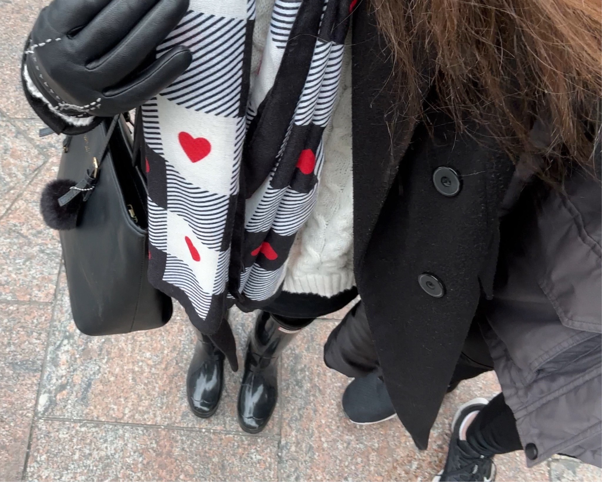 Original coat is Petal & Pup. Currently sold out so I’ve added an alternative. Gloves and skirt are sold out/old and have been substituted.

Pop of Color Winter Outfit Inspo | Red, Black, & White. I’m wearing a long black trench coat, white knit sweater, cami + long sleeved shirt for layering, a black mini skirt, tall black rainboots, black tote bag, and colorful red, black, & white scarf. 