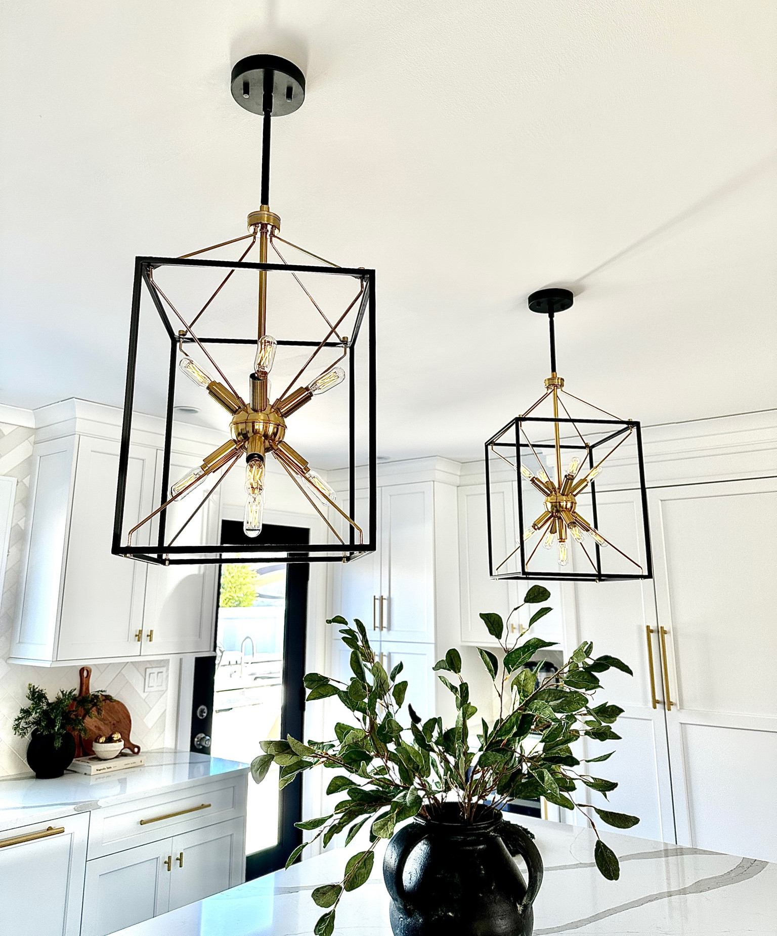 Black gold 9 light modern pendant light, kitchen chandelier, kitchen decor, lighting, Sputnik pendant light, pottery barn Joshua vase, spring greenery, eucalyptus stems, cutting board 
***the Amazon lights keep selling out so I have a few other shops linked here too! Still affordable! 
#LTKSale 

#LTKhome #LTKFind